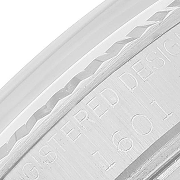 The image shows a close-up detail of the case side and engraving on a Rolex Datejust 1601 Men
s Stainless Steel Silver Dial 1601 Men
s Stainless Steel Silver Dial watch.