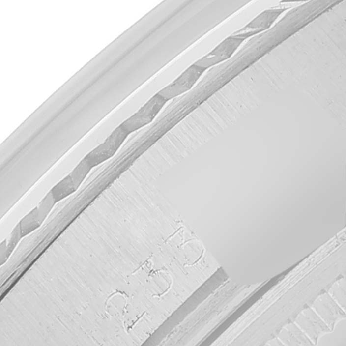 This image shows a close-up of the engraved side of the bezel of a Rolex Datejust 1601 Men
s Stainless Steel Silver Dial 1601 Men
s Stainless Steel Silver Dial watch.