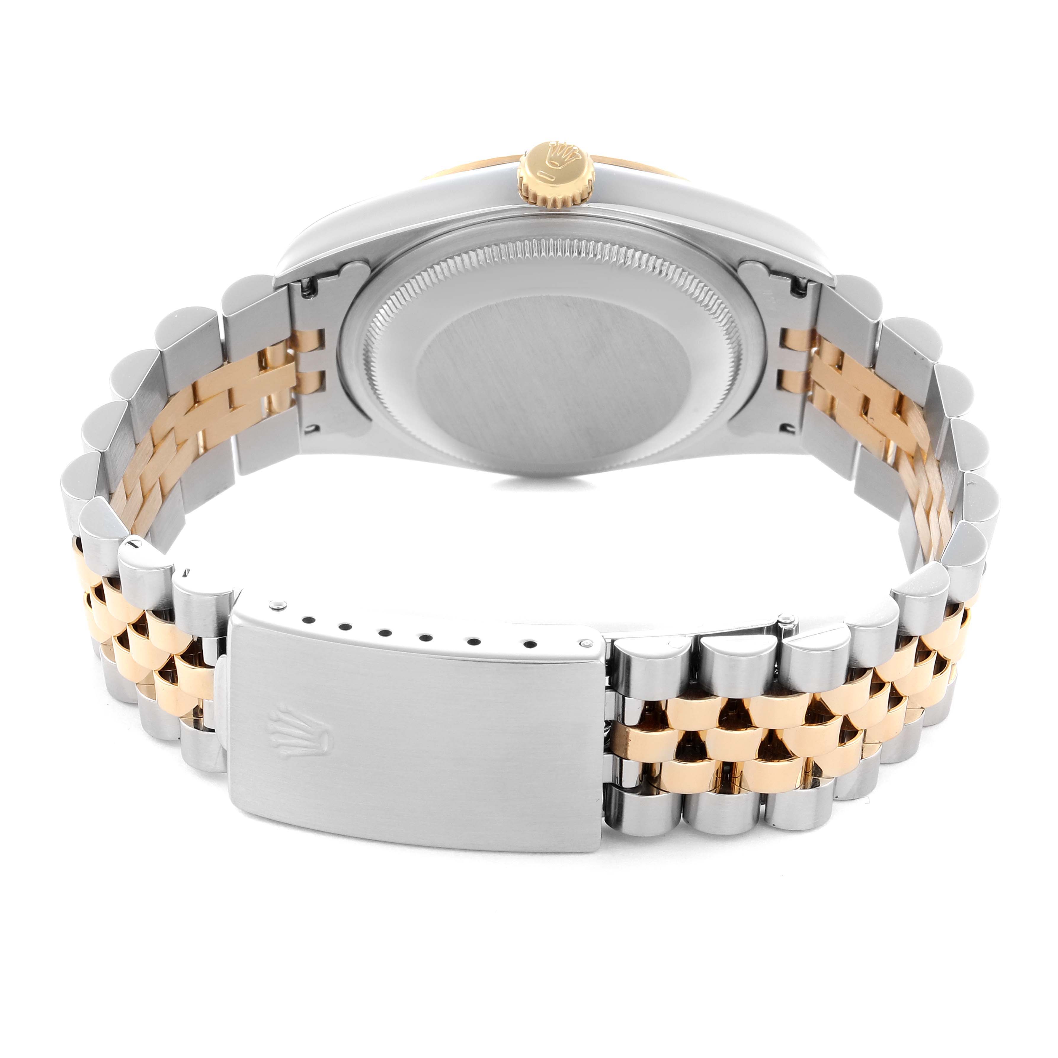 The image shows the back view of a Rolex Datejust model 16233 men's watch, highlighting the case back, crown, and two-tone jubilee bracelet with clasp.