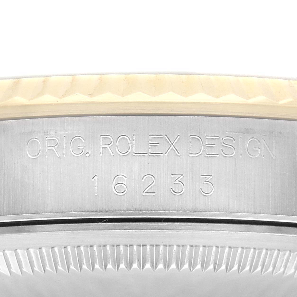 The image shows a close-up angle of the side of a Rolex Datejust, model 16233, focusing on the engraved text "ORIG. ROLEX DESIGN 16233" on the case.