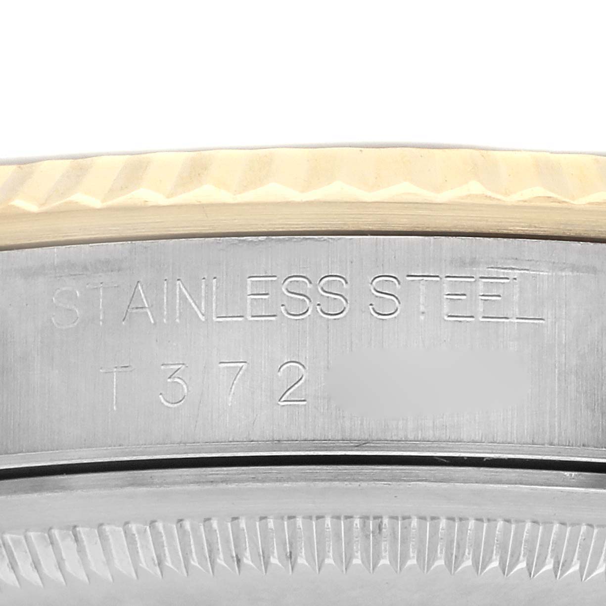 The image shows a close-up side view of the case edge of a Rolex Datejust model 16233, highlighting the stainless steel material and engraving details.