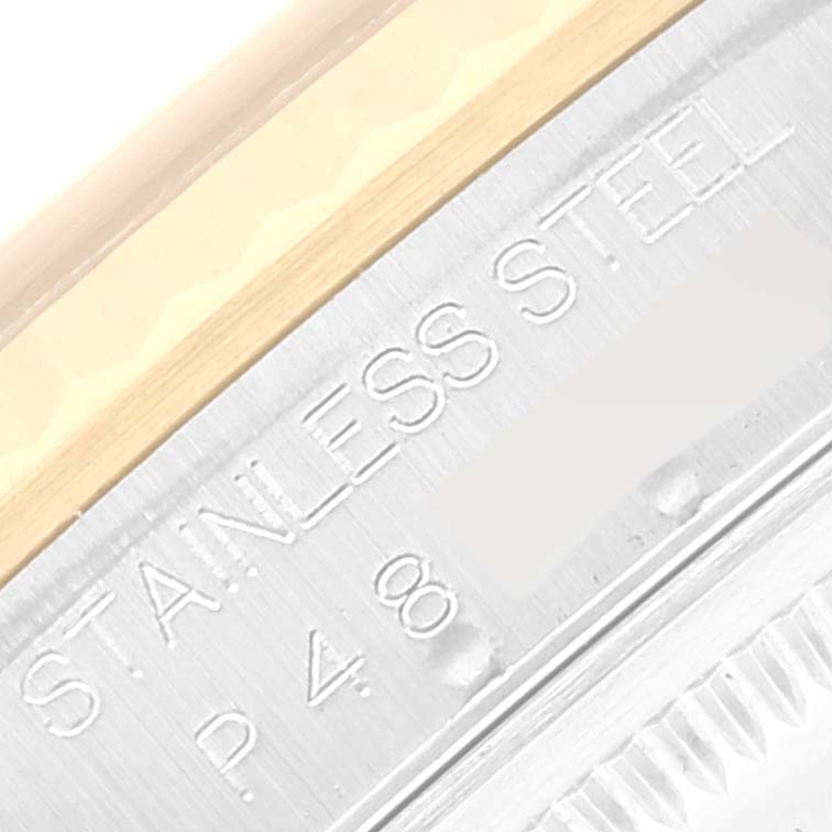 This image is a close-up of the bezel and inner case back of a Rolex Datejust 16233 Men's Steel and Gold (two tone) White Dial 16233 Men's Steel and Gold (two tone) White Dial, highlighting the "STAINLESS STEEL" engraving.