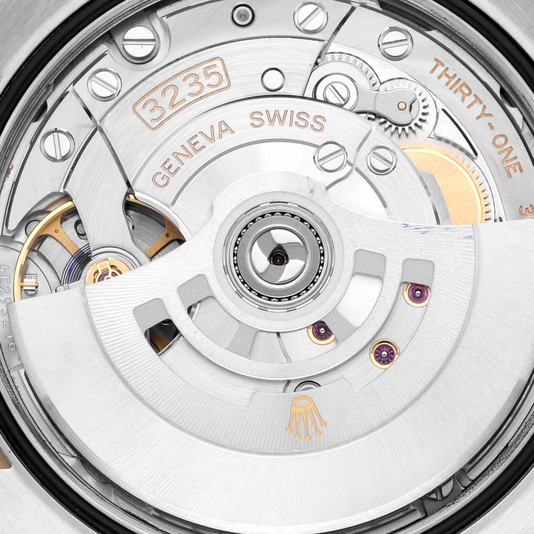This image shows a close-up view of the movement mechanism in the Rolex Datejust 126233 Men
s Steel and Gold (two tone) Champagne Dial 126233 Men
s Steel and Gold (two tone) Champagne Dial watch model, specifically the 3235 caliber with Geneva Swiss markings.