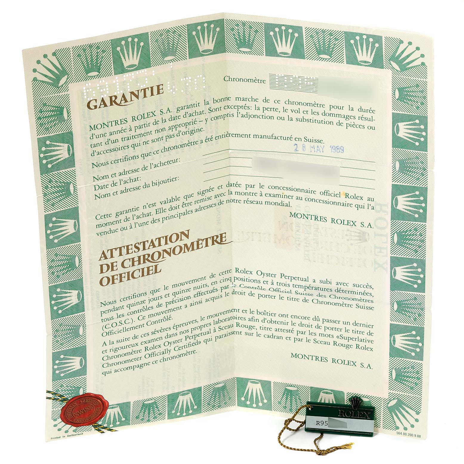 The image shows a Rolex Datejust 69173 Women's Steel and Gold (two tone) Champagne Dial 69173 Women's Steel and Gold (two tone) Champagne Dial warranty certificate with seals and a tag, viewed from the front at a slight angle.