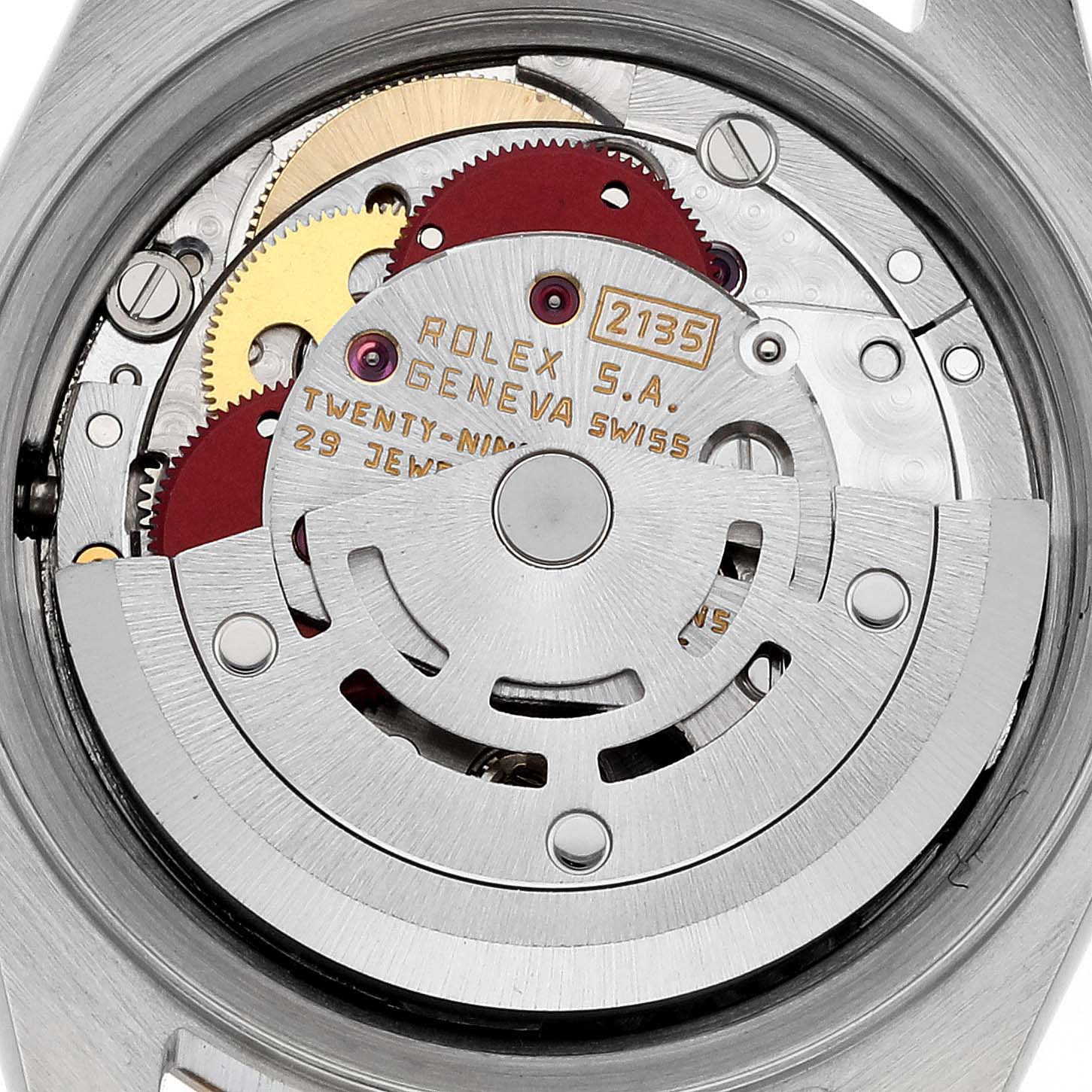 The image shows a close-up of the movement inside a Rolex Datejust 69173 Women's Steel and Gold (two tone) Champagne Dial 69173 Women's Steel and Gold (two tone) Champagne Dial watch, highlighting gears and inscriptions.