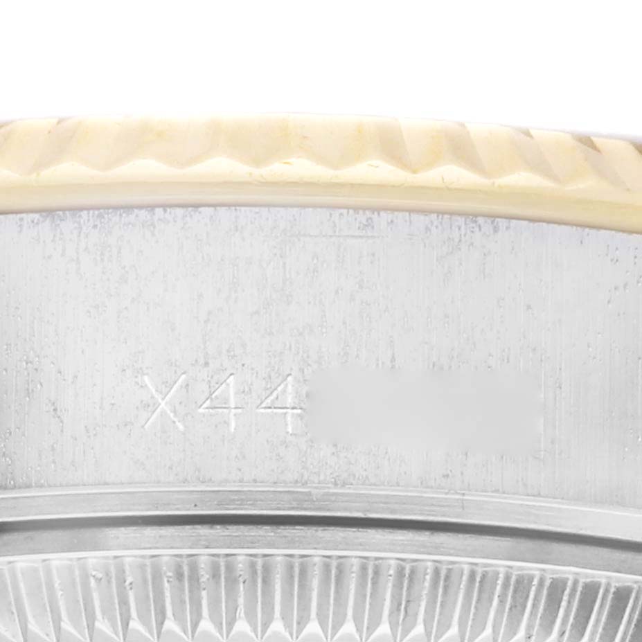 This image shows a close-up of the Rolex Datejust 69173 Women's Steel and Gold (two tone) Champagne Dial 69173 Women's Steel and Gold (two tone) Champagne Dial model's bezel and case with a partial reference number.