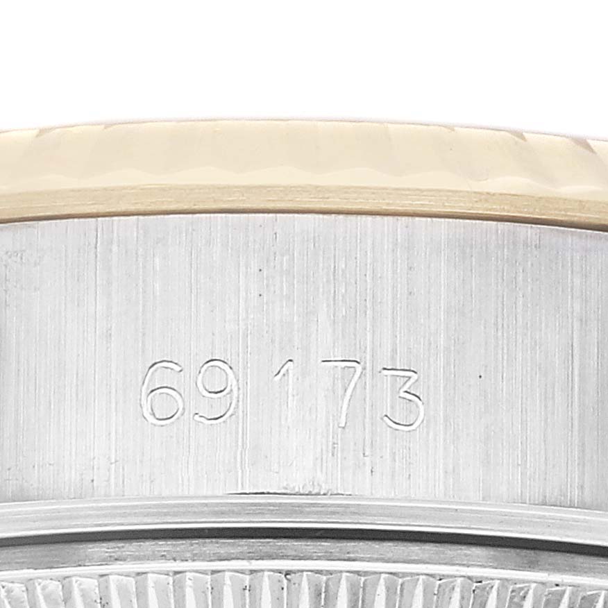 This image shows a close-up of the case side with the engraved model number of a Rolex Datejust 69173 Women's Steel and Gold (two tone) Champagne Dial 69173 Women's Steel and Gold (two tone) Champagne Dial watch.