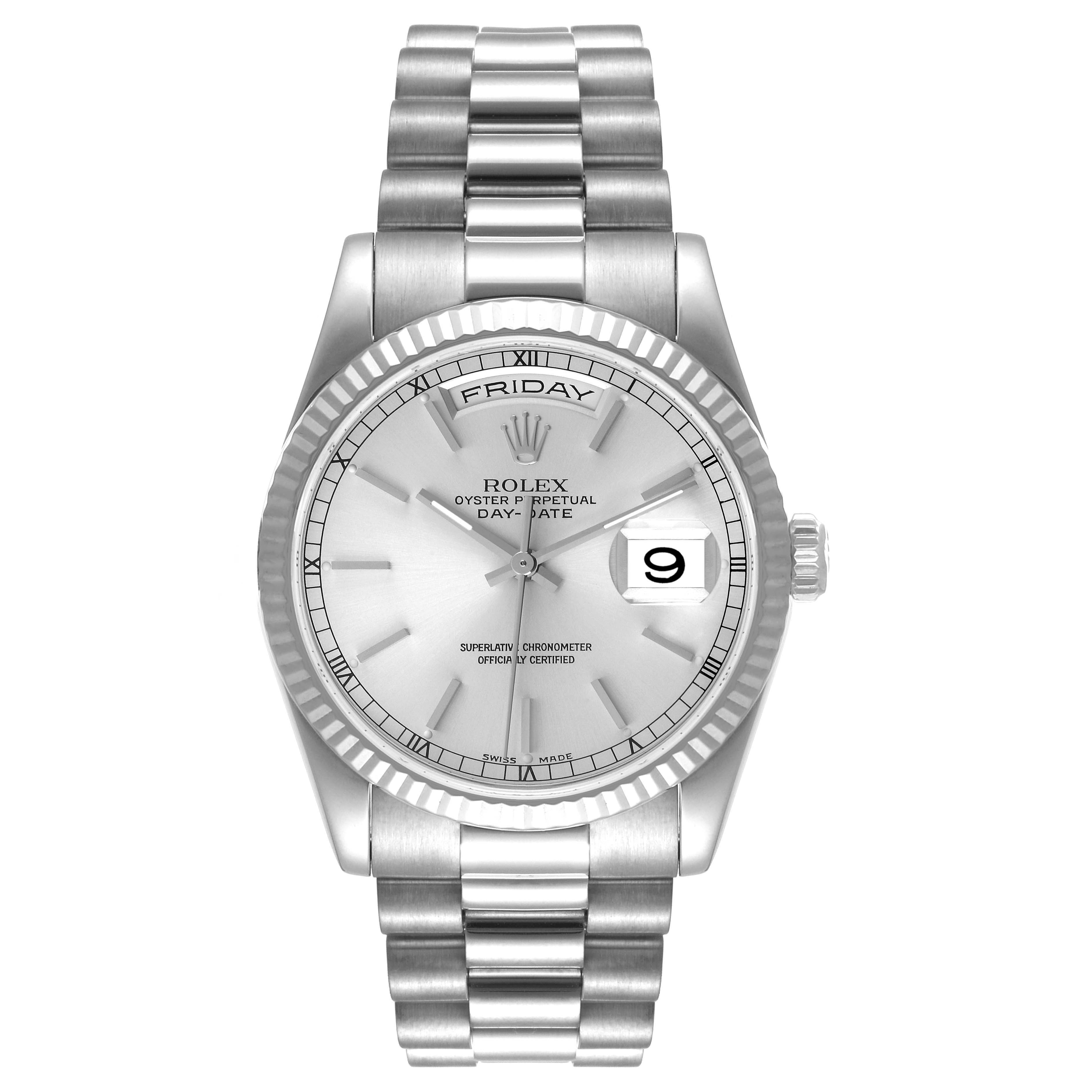 The Rolex President 118239 Men's White Gold Silver Dial 118239 Men's White Gold Silver Dial model is shown from a front view, highlighting its silver dial, day and date displays, fluted bezel, and President bracelet.