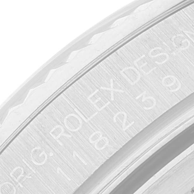This image shows a close-up view of the engraved inner bezel of a Rolex President 118239 Men's White Gold Silver Dial 118239 Men's White Gold Silver Dial model watch.