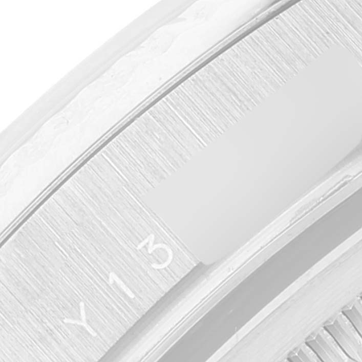 The image shows a close-up of the bezel and part of the case detailing of a Rolex President 118239 Men's White Gold Silver Dial 118239 Men's White Gold Silver Dial model watch.