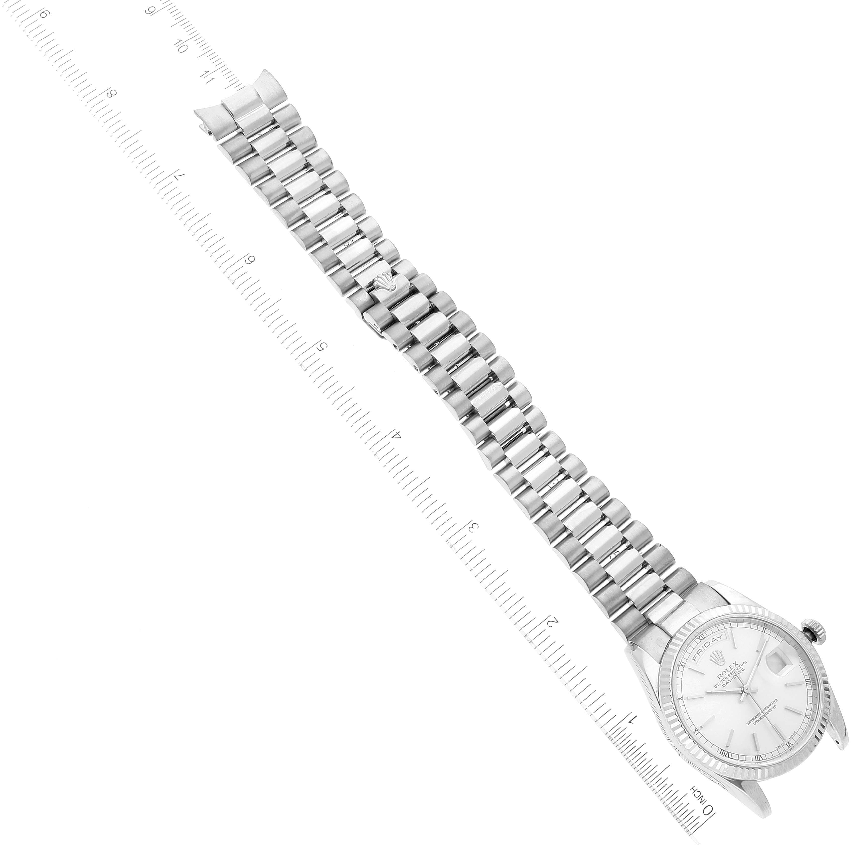 The image shows the Rolex President 118239 Men's White Gold Silver Dial 118239 Men's White Gold Silver Dial model watch from a top-down angle, featuring the face, bracelet, and clasp, alongside a measuring ruler.
