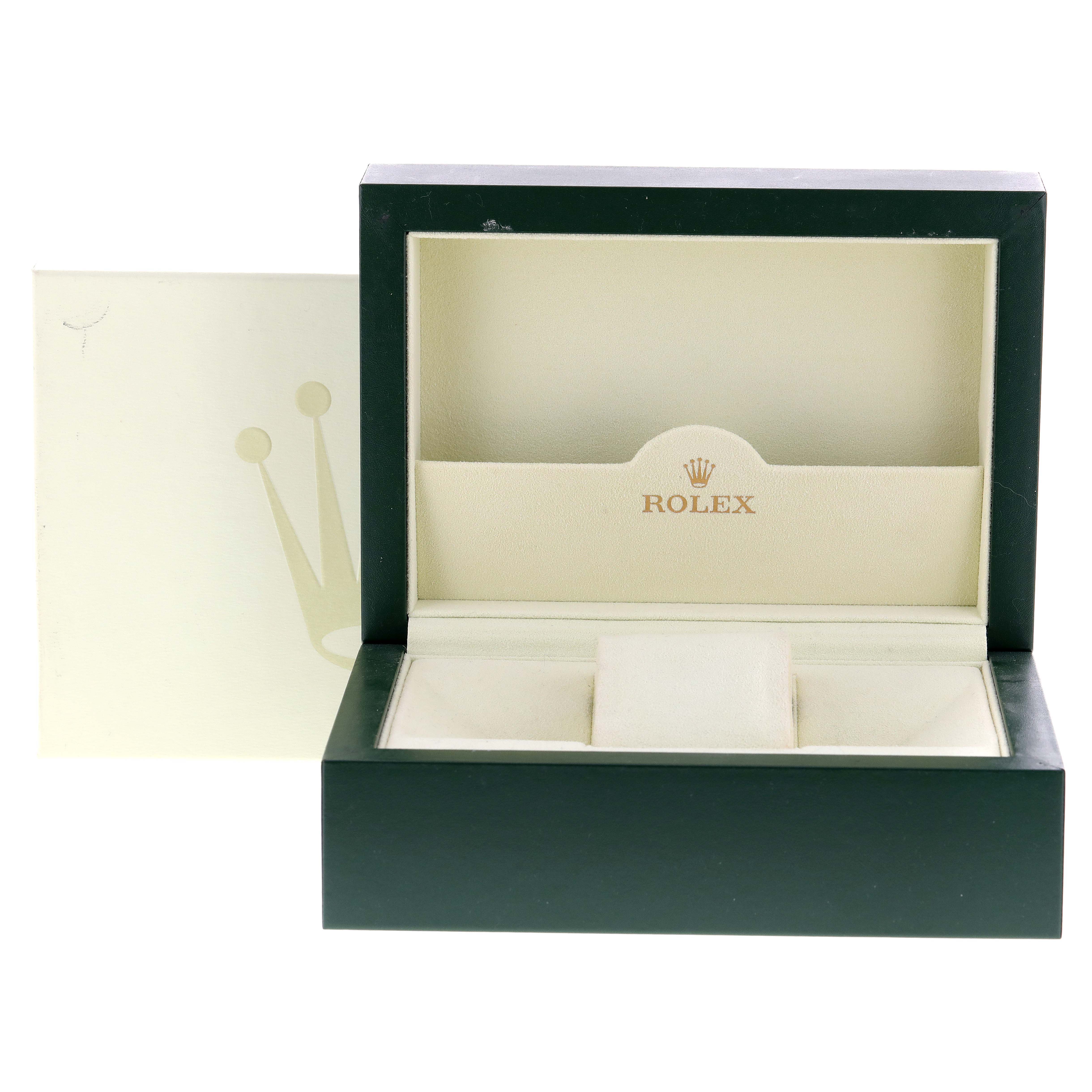 The image shows an open green and beige Rolex watch box meant for a Daytona model, viewed from the front.