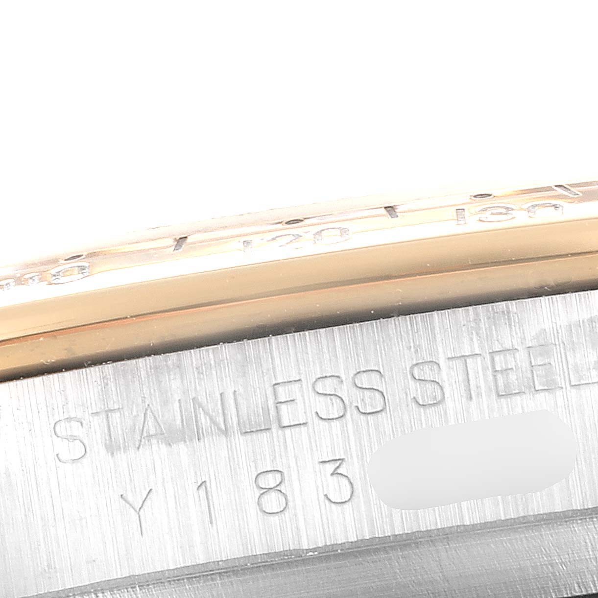 This is a close-up view of the stainless steel outer case and part of the bezel of a Rolex Daytona 16523 Men's Steel and Gold (two tone) Grey Dial 16523 Men's Steel and Gold (two tone) Grey Dial watch.