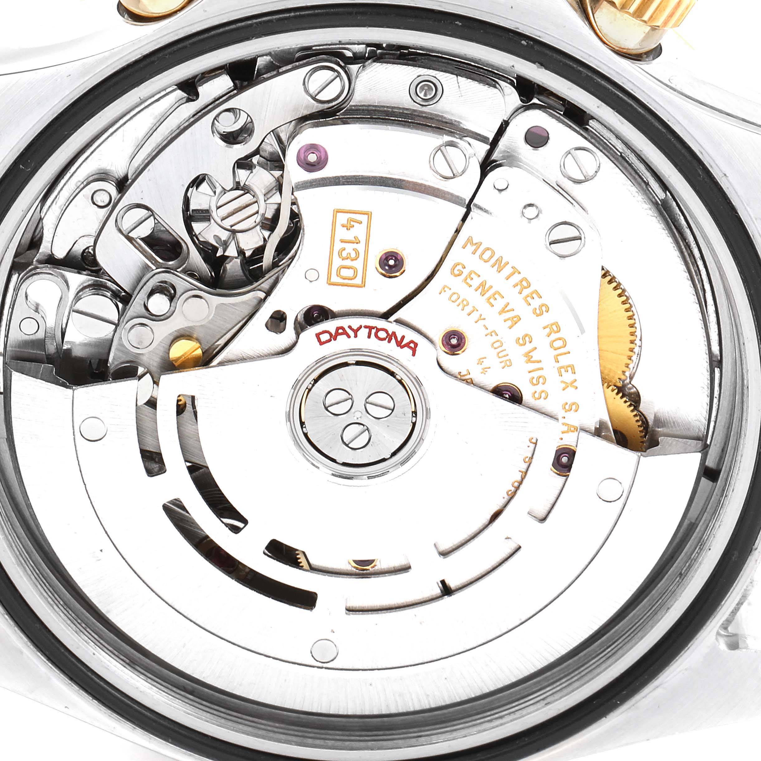 The image shows the inner mechanics and movement of a Rolex Daytona 16523 Men's Steel and Gold (two tone) Grey Dial 16523 Men's Steel and Gold (two tone) Grey Dial watch, focusing on its intricate components.
