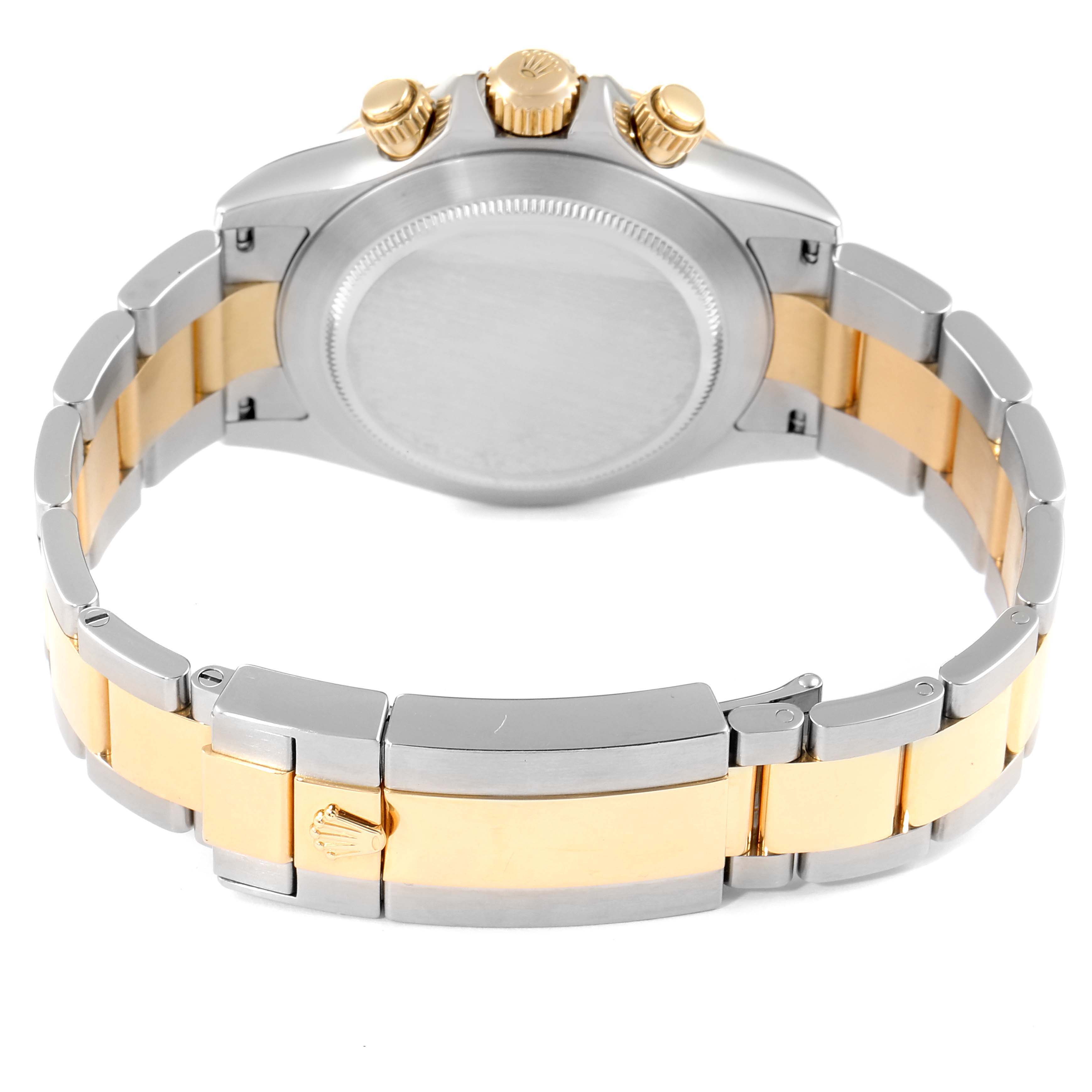 The image shows the back and clasp of the Rolex Daytona 116523 Men
s Steel and Gold (two tone) Black Dial 116523 Men
s Steel and Gold (two tone) Black Dial watch, highlighting its two-tone metal bracelet and case back.