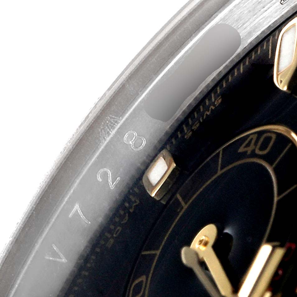This close-up of the Rolex Daytona 116523 Men
s Steel and Gold (two tone) Black Dial 116523 Men
s Steel and Gold (two tone) Black Dial watch shows the serial number engraving and a portion of the dial with the 40 marker.