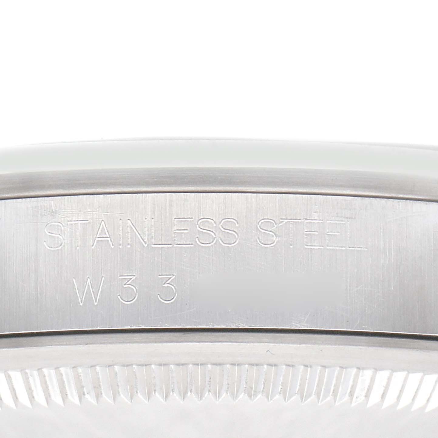 The image displays a close-up view of the side of the Rolex Explorer model 14270, showing the engraved text on the stainless steel casing.