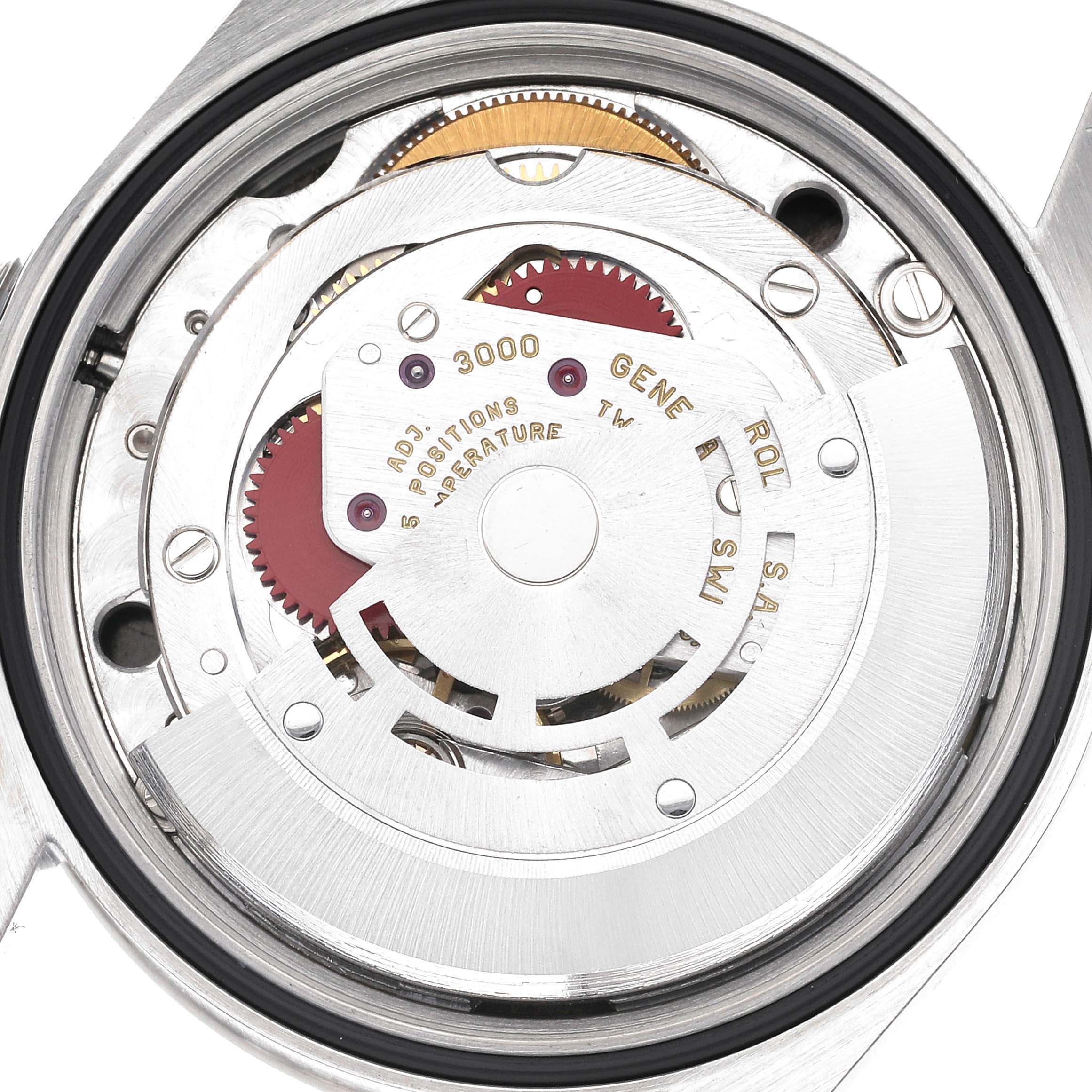The image shows a close-up of the movement inside a Rolex Explorer model 14270 men's watch, highlighting the gears and rotor.