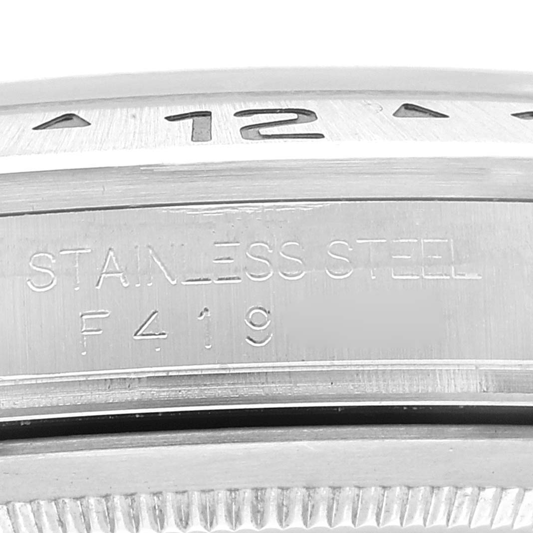 This close-up image shows the engravings on the side of the bezel and case of a Rolex Explorer 16570 Men
s Stainless Steel Black Dial 16570 Men
s Stainless Steel Black Dial watch.