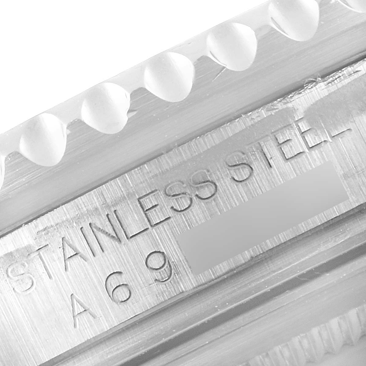 This image shows a close-up of the engraved text on the stainless steel caseback edge of a Rolex GMT-Master 16710 Men
s Stainless Steel Black Dial 16710 Men
s Stainless Steel Black Dial watch.