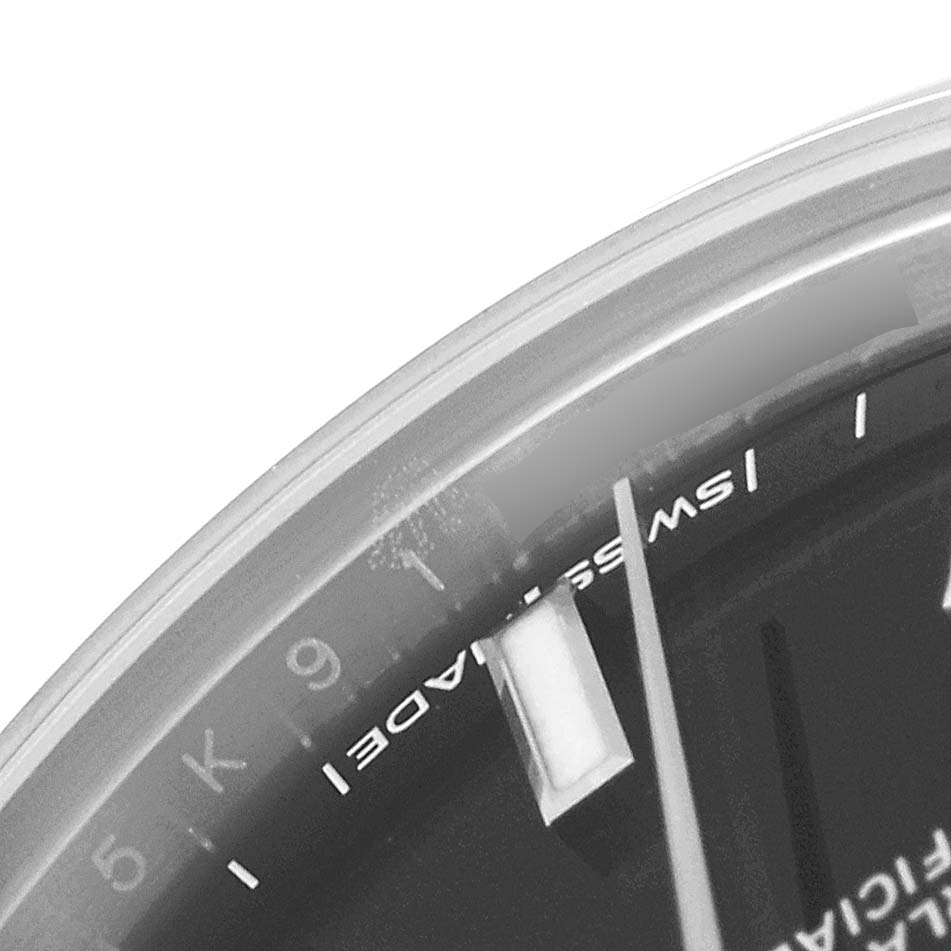 This image shows a close-up of the dial edge and the "Swiss Made" marking on a Rolex Mid-Size 177200 Women's Stainless Steel Black Dial 177200 Women's Stainless Steel Black Dial watch.