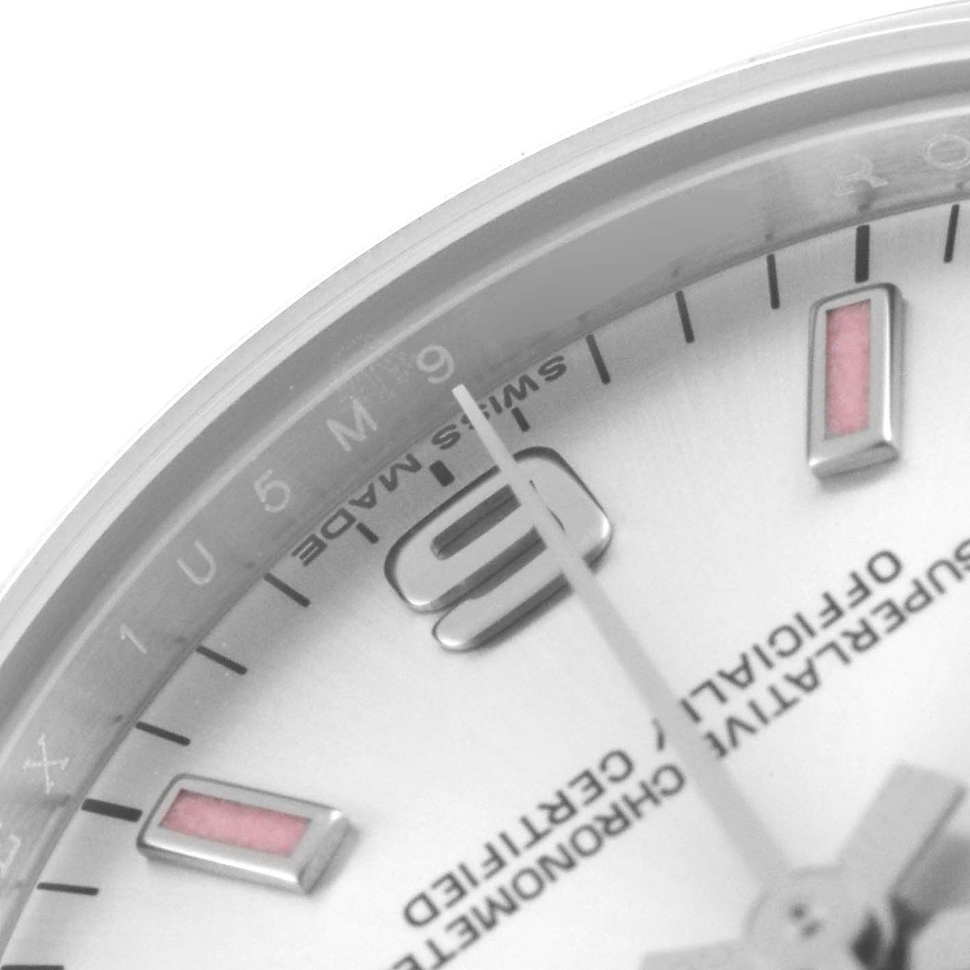 The image shows a close-up view of a Rolex Mid-Size 177200 Women
s Stainless Steel Silver Dial 177200 Women
s Stainless Steel Silver Dial watch dial, highlighting the 9 o
clock marker and the second hand.