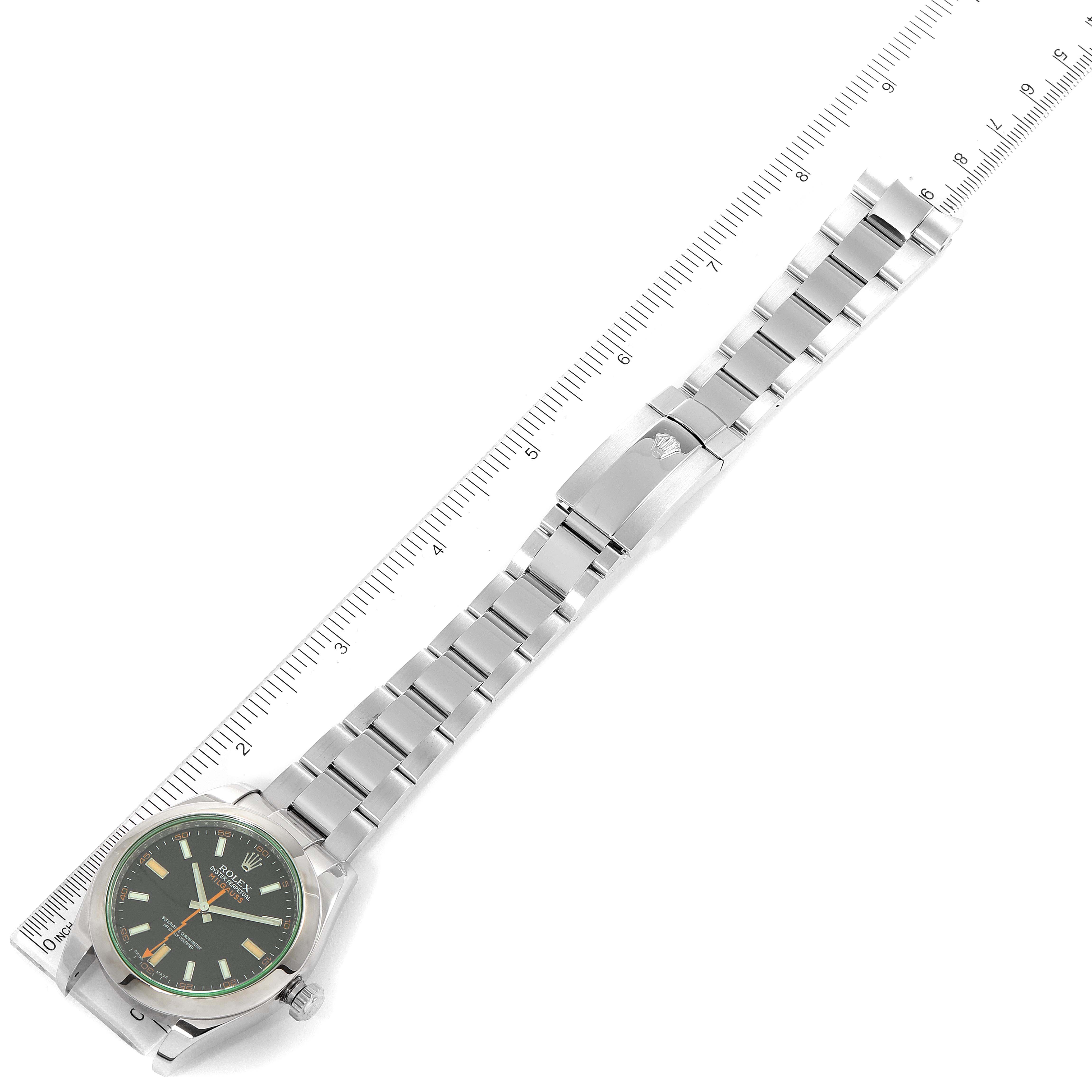 This image shows a top view of a Rolex Milgauss 116400GV Men
s Stainless Steel Black Dial 116400GV Men
s Stainless Steel Black Dial watch, displaying the dial, bracelet, and clasp alongside a measuring ruler.