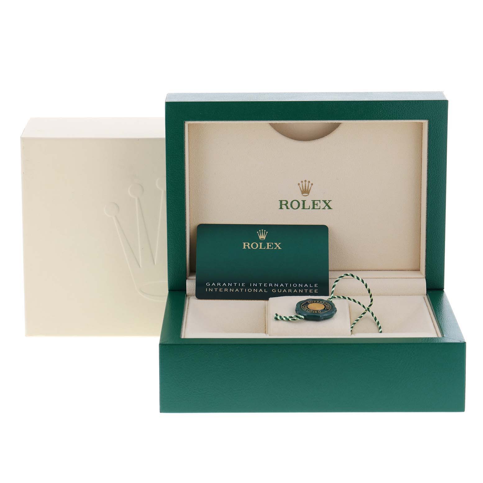 The image shows the packaging and accessories for a Rolex Oyster Perpetual 124200 Men
s Stainless Steel Pink Dial 124200 Men
s Stainless Steel Pink Dial watch, including the box, guarantee card, and tag.