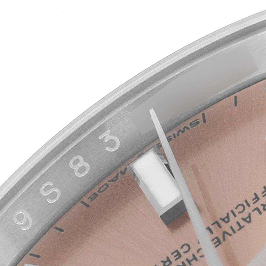 The image shows a close-up of the dial and hands of a Rolex Oyster Perpetual 124200 Men
s Stainless Steel Pink Dial 124200 Men
s Stainless Steel Pink Dial watch, focusing on the 3-hour marker.
