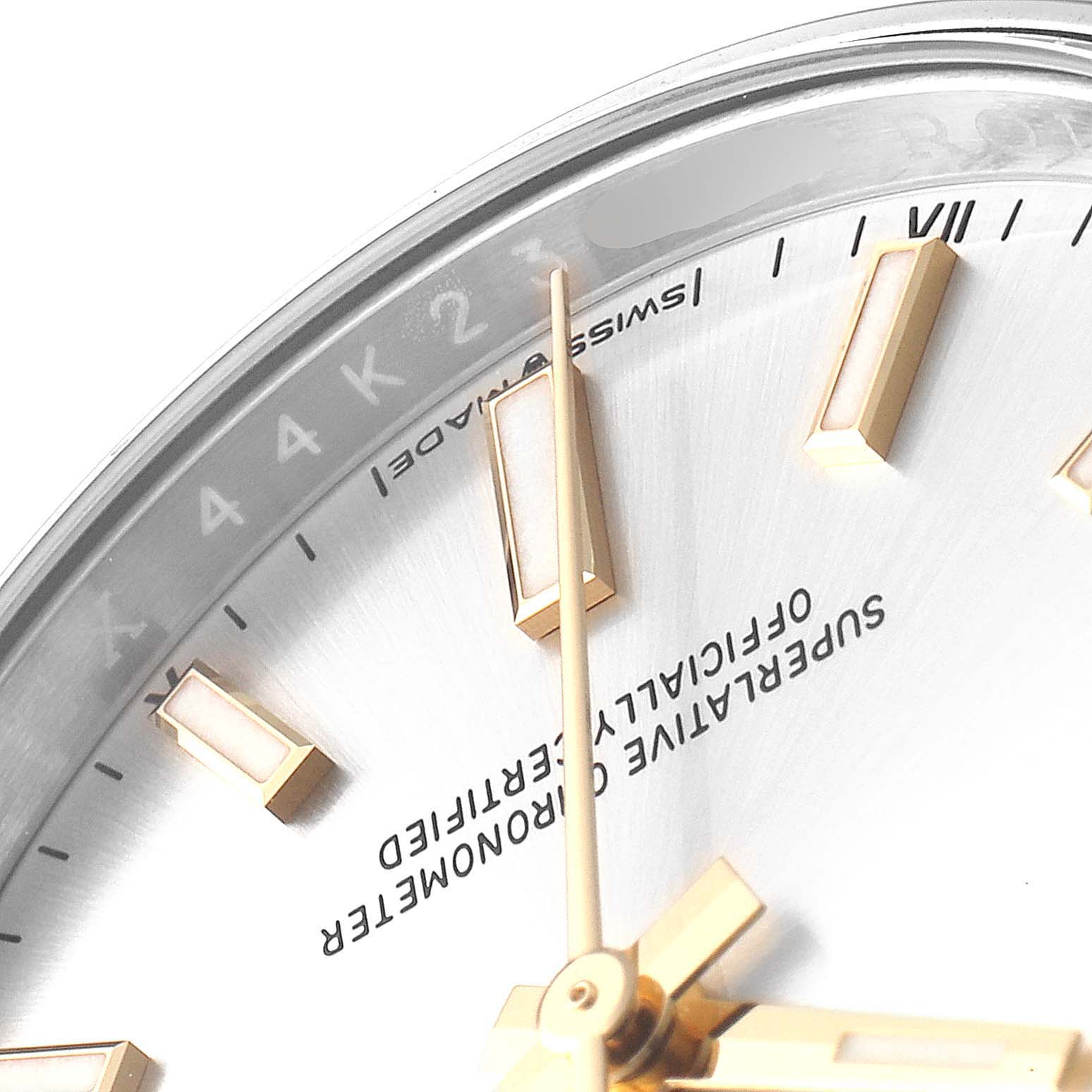 This close-up image of a Rolex Oyster Perpetual 124200 Men's Stainless Steel Silver Dial 124200 Men's Stainless Steel Silver Dial watch shows the dial, minute and hour hands, and part of the hour markers.