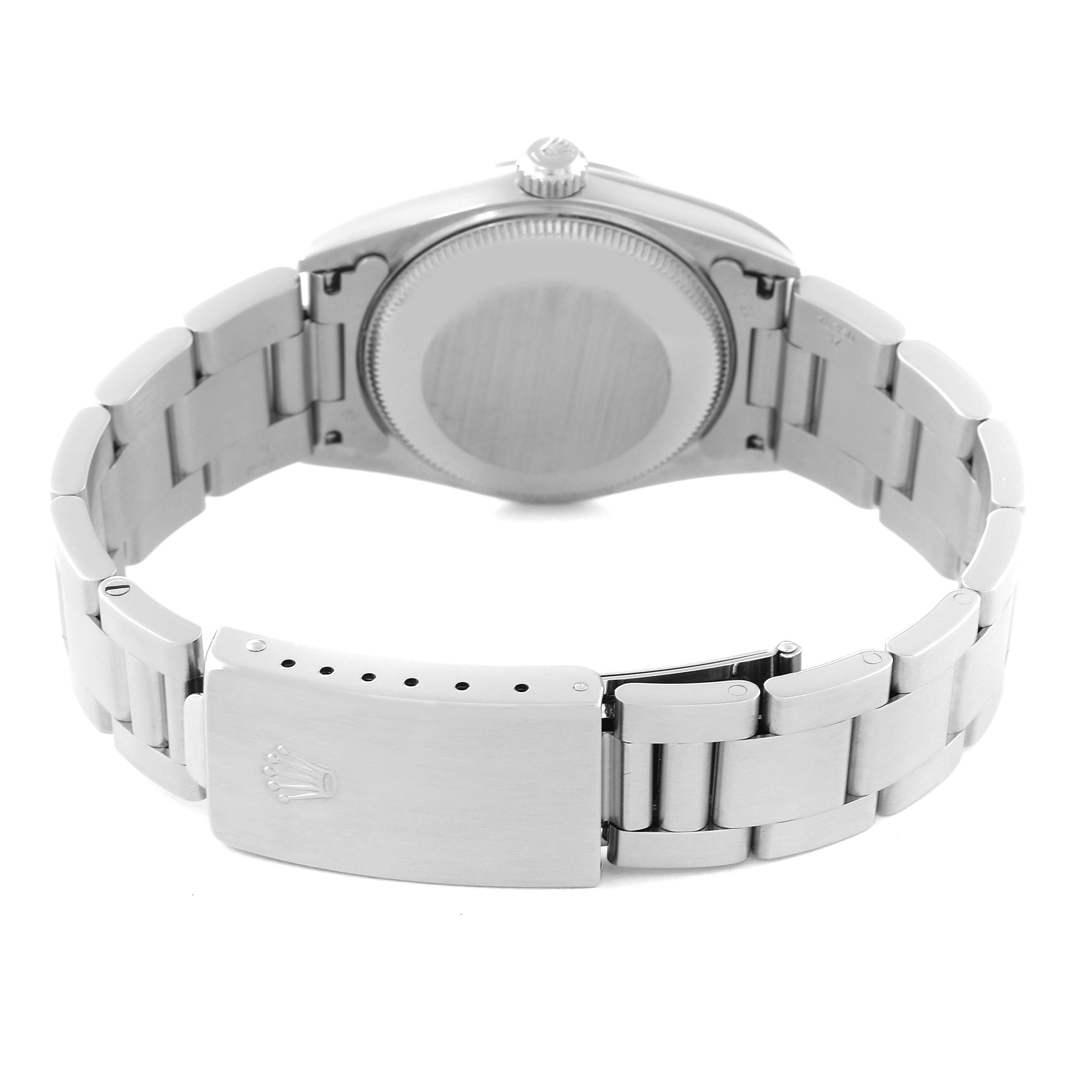 This is a rear view of the Rolex Mid-Size 77080 Women's Stainless Steel Pink Dial 77080 Women's Stainless Steel Pink Dial model watch showing its closed clasp and case back.