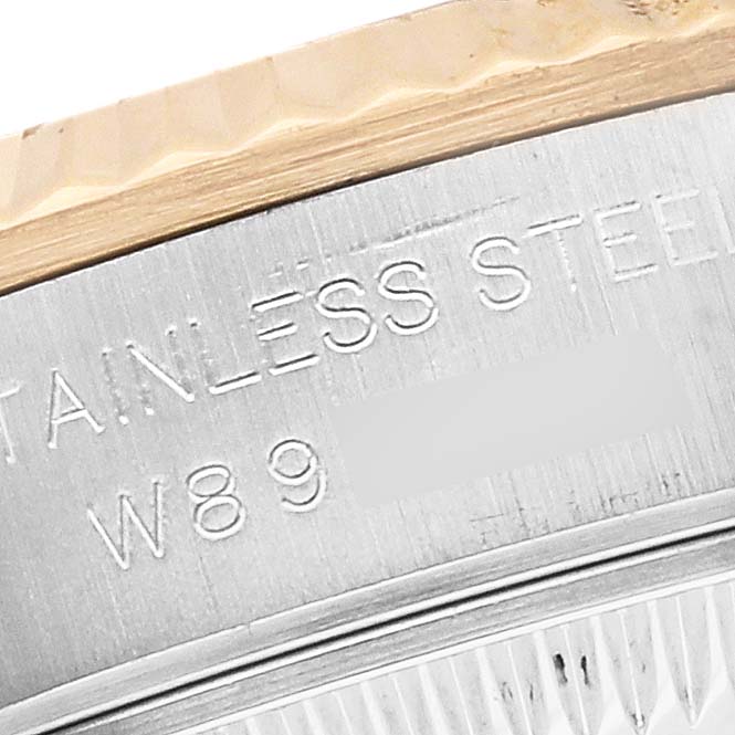 The image shows a close-up of the case back and bezel of a Rolex Oyster Perpetual 67193 Women
s Steel and Gold (two tone) White Dial 67193 Women
s Steel and Gold (two tone) White Dial model, highlighting the stainless steel material.