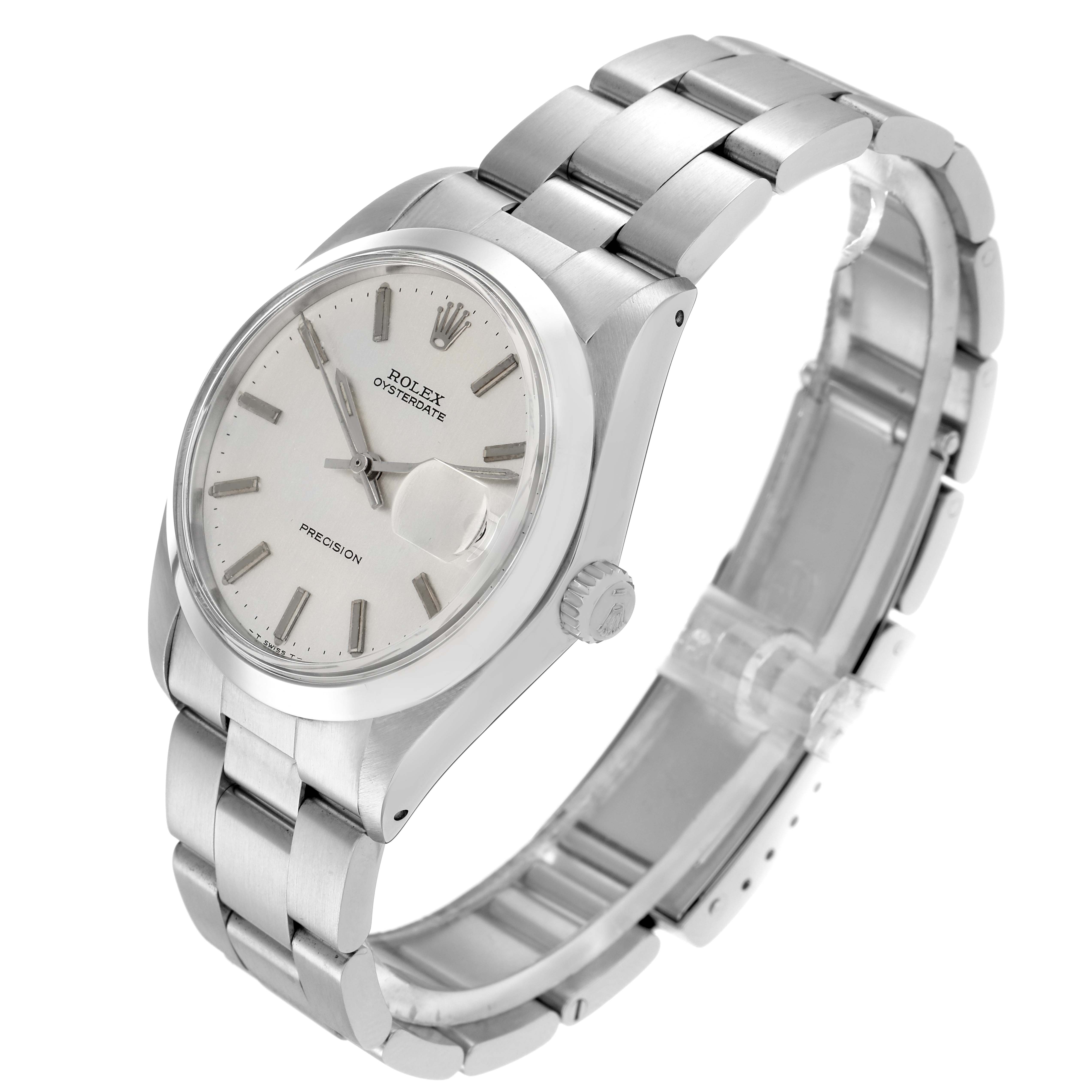 The Rolex Vintage Collection model 6694 is shown at a three-quarter angle, revealing the watch face, crown, and stainless steel bracelet.
