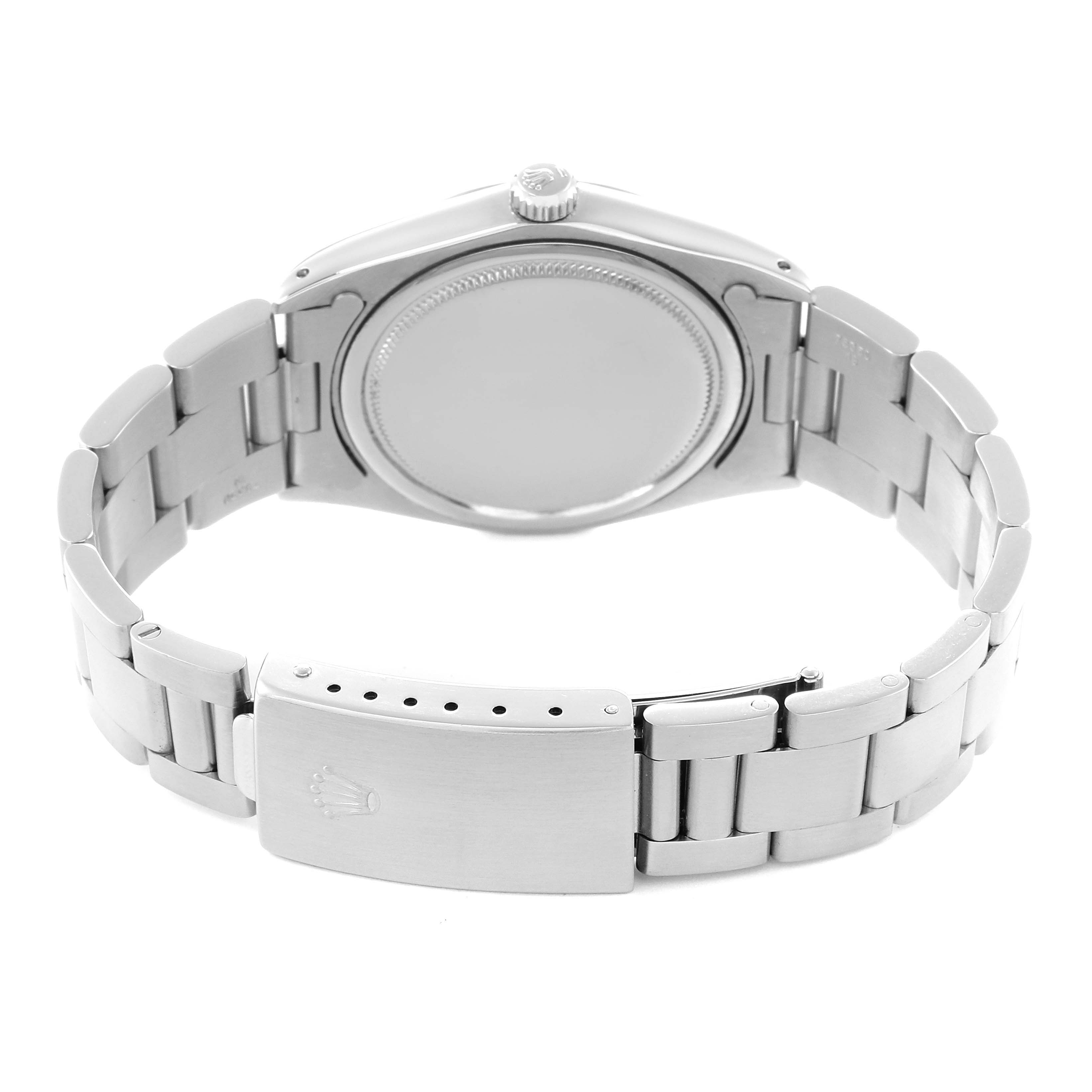 The image shows a rear view of the Rolex Vintage Collection watch, model number 6694, highlighting the case back, crown, and bracelet clasp.