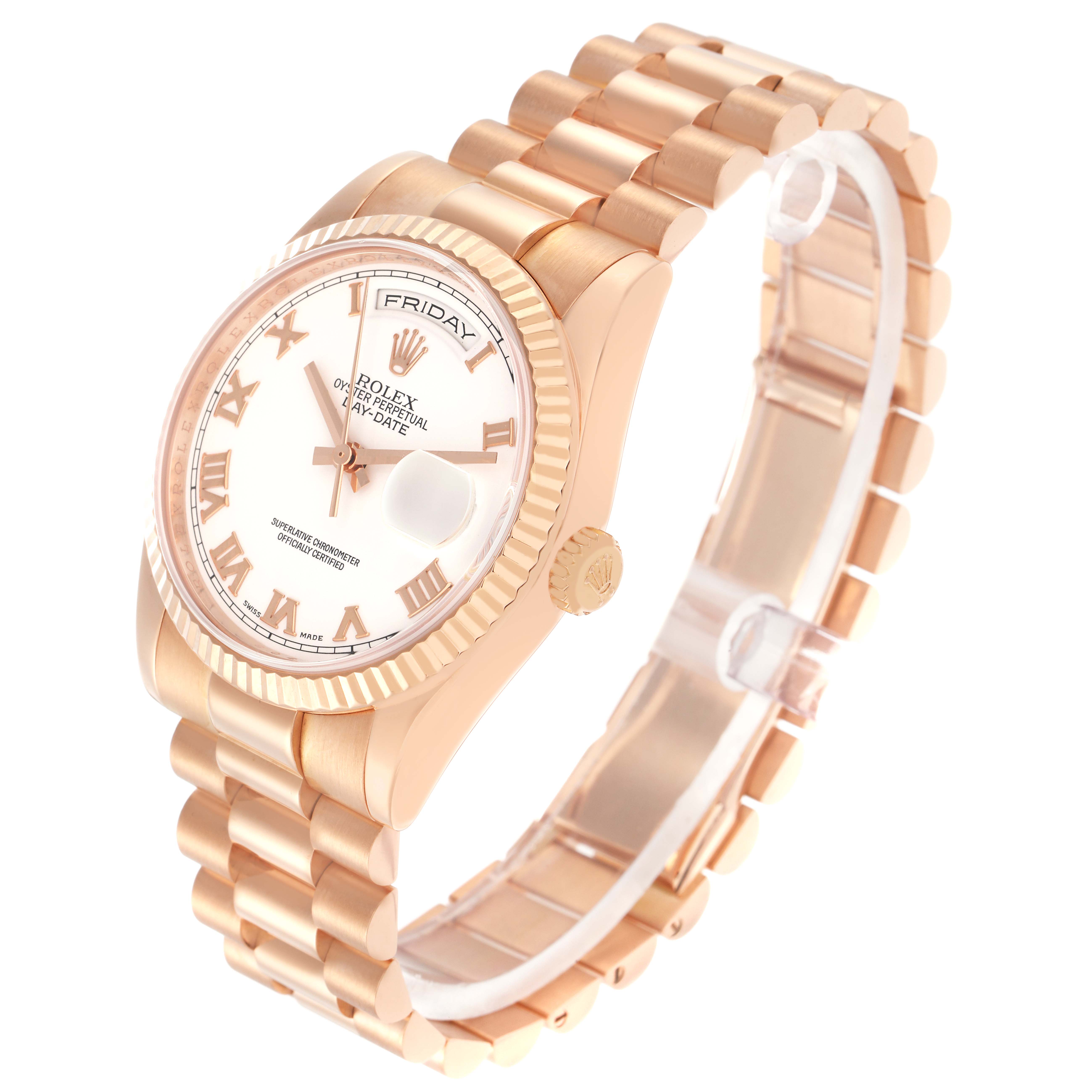 The Rolex President model 118235, a men's watch, is shown at an angled view highlighting the rose gold case, bracelet, fluted bezel, and day-date display.