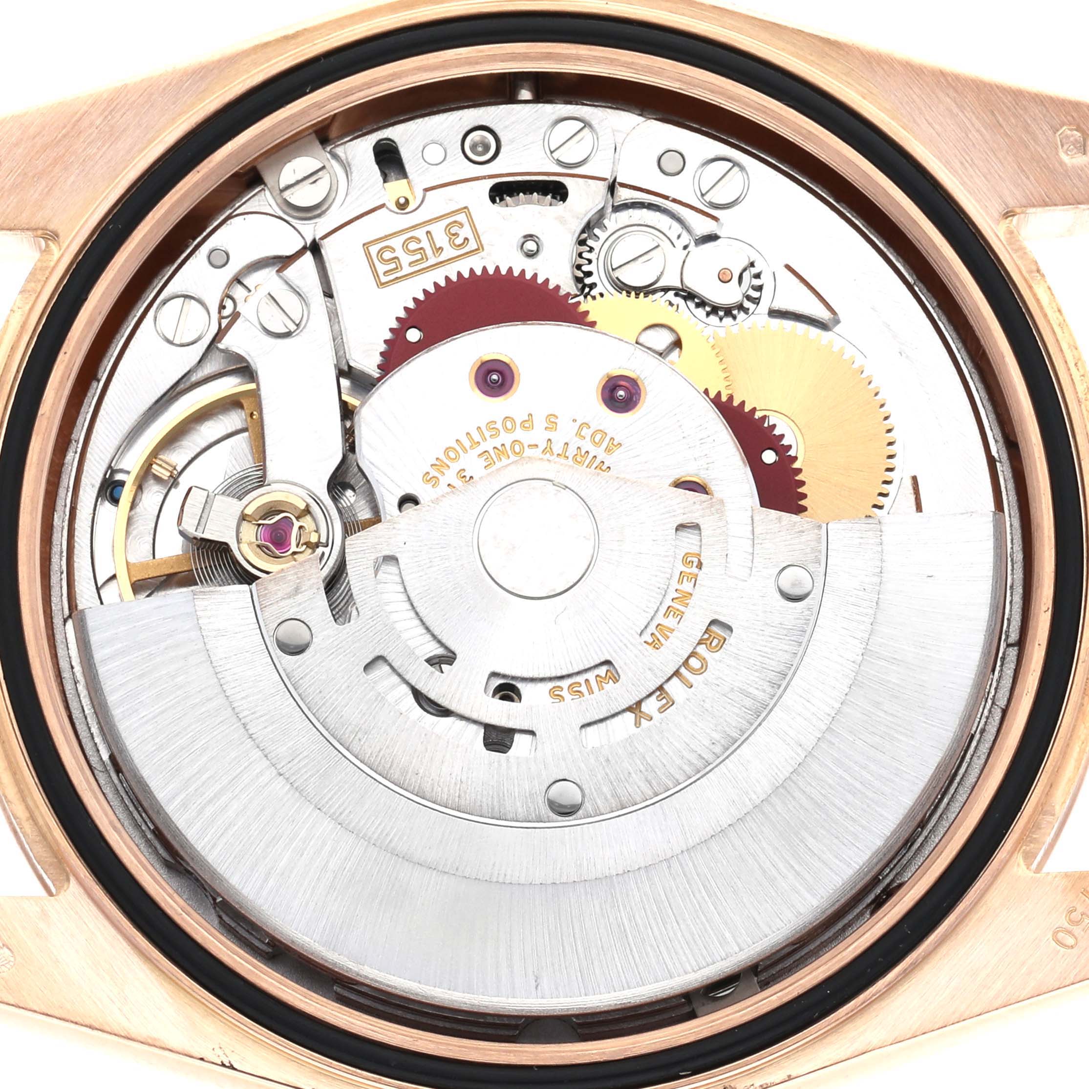 The image shows the movement of a Rolex President model, model number 118235, viewed from the case back, highlighting gears and mechanical components.