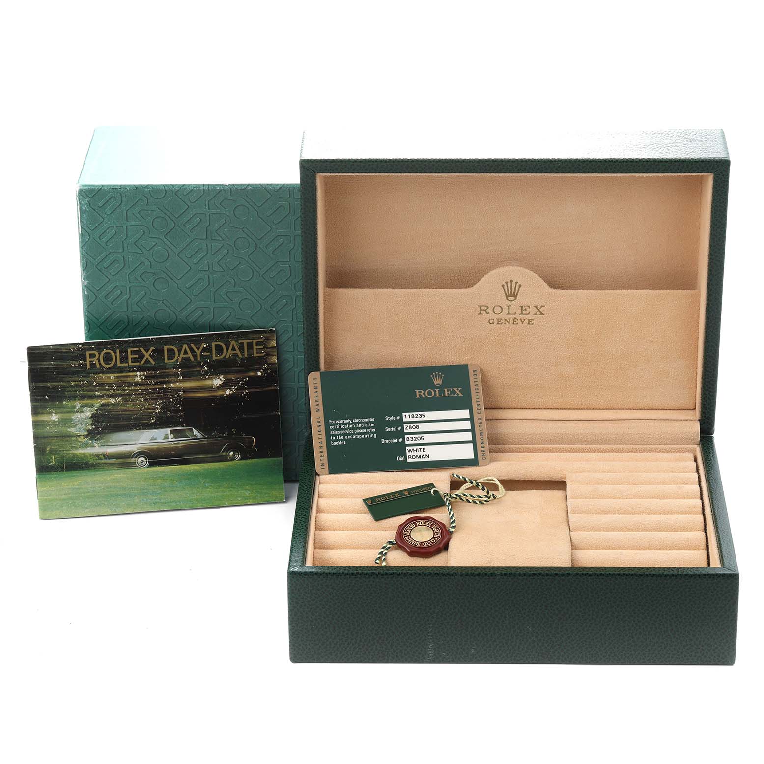 The image shows accessories for the Rolex President model 118235, including a presentation box, warranty card, booklet, and tags.