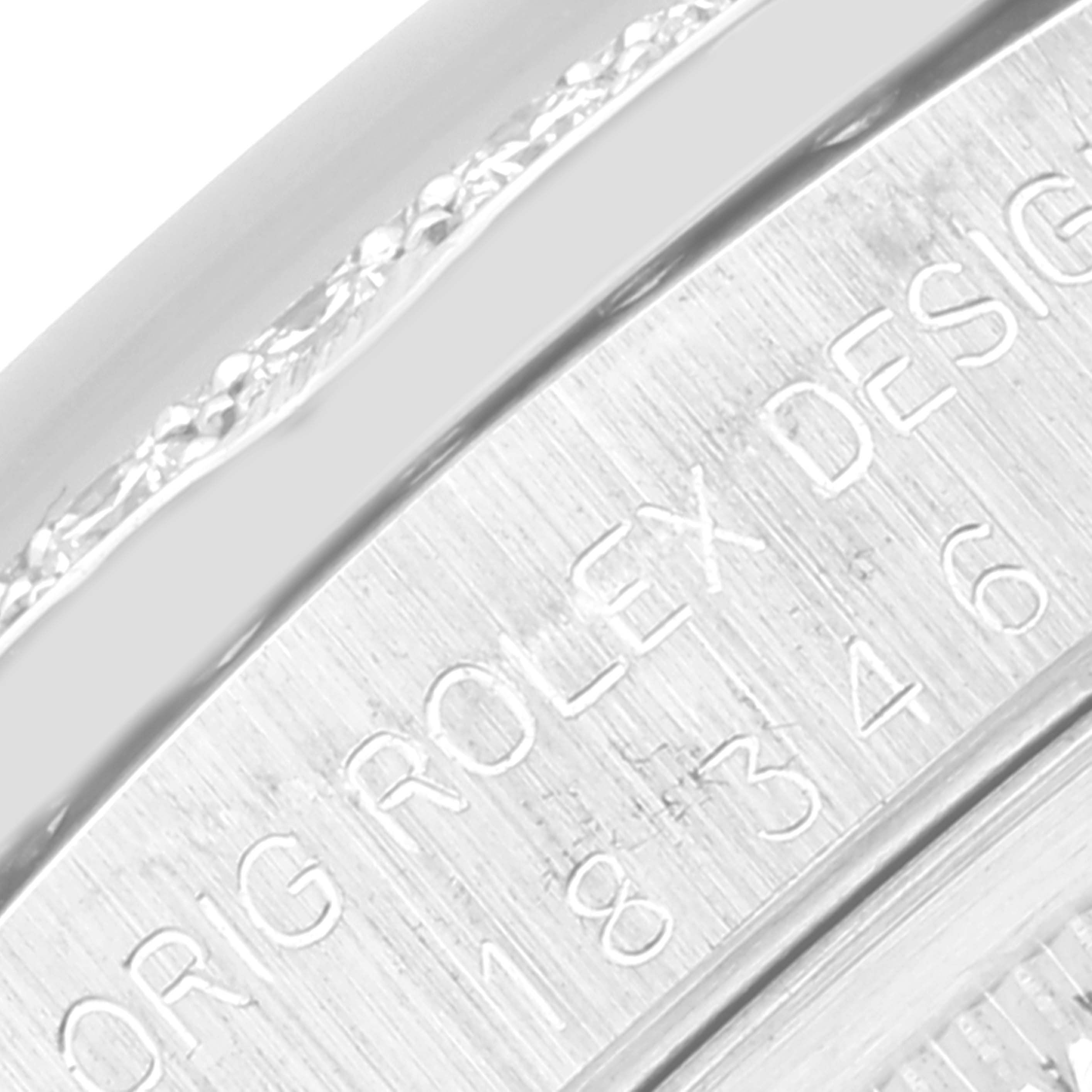 This close-up image shows the engraved edge of the case back for a Rolex President 18346 Men's Platinum Silver Dial 18346 Men's Platinum Silver Dial model watch.