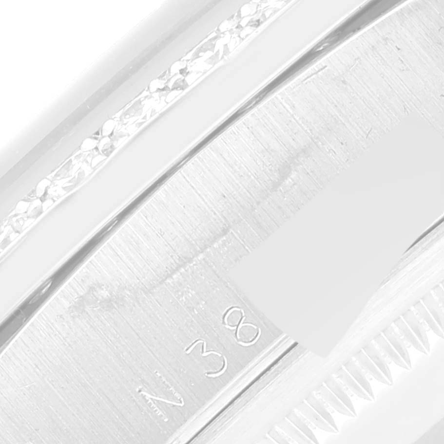 This is a close-up image of the side of a Rolex President 18346 Men's Platinum Silver Dial 18346 Men's Platinum Silver Dial model watch, showcasing part of the bezel and band.