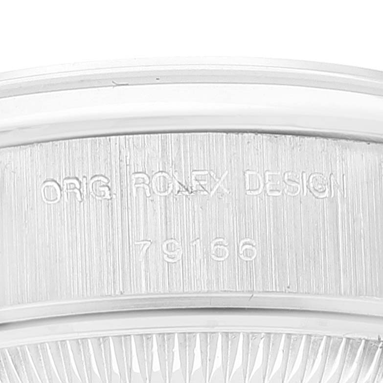 This close-up image shows the side casing of the Rolex President 79166 Women's Platinum Silver Dial 79166 Women's Platinum Silver Dial model watch, with "ORIG. ROLEX DESIGN" engraved.