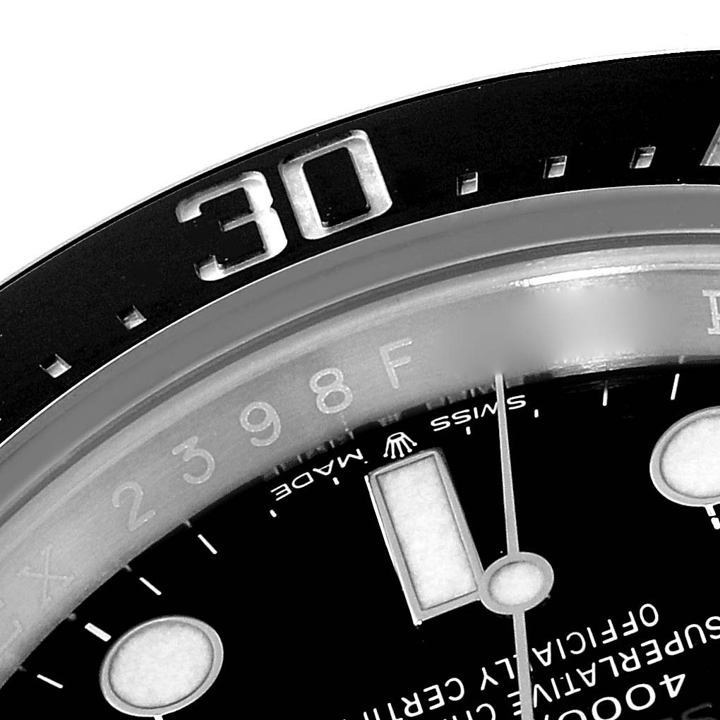 The image shows a close-up of the bezel and partial dial of the Rolex Sea-Dweller 126600 Men
s Stainless Steel Black Dial 126600 Men
s Stainless Steel Black Dial watch, specifically the 30-minute mark.
