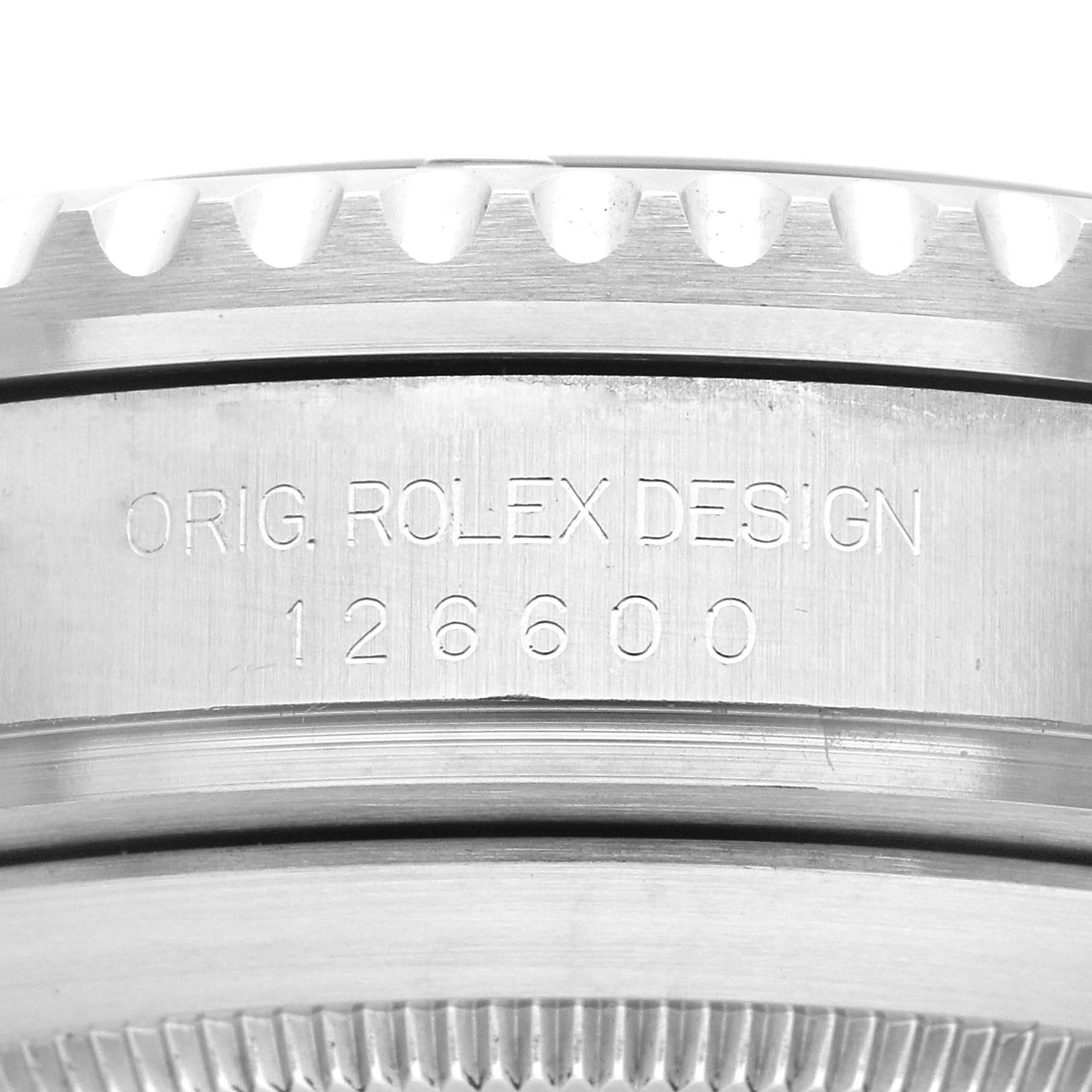 This image shows a close-up of the side of a Rolex Sea-Dweller 126600 Men
s Stainless Steel Black Dial 126600 Men
s Stainless Steel Black Dial model, displaying the engravings "ORIG. ROLEX DESIGN 126600".
