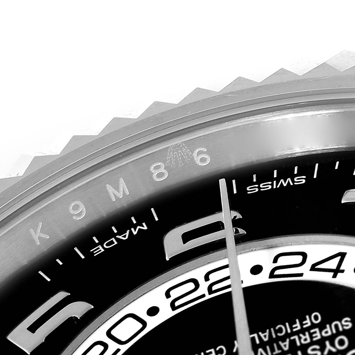 The image shows a close-up of the bezel and part of the dial of the Rolex Sky-Dweller 326139 Men's White Gold Black Dial 326139 Men's White Gold Black Dial watch.