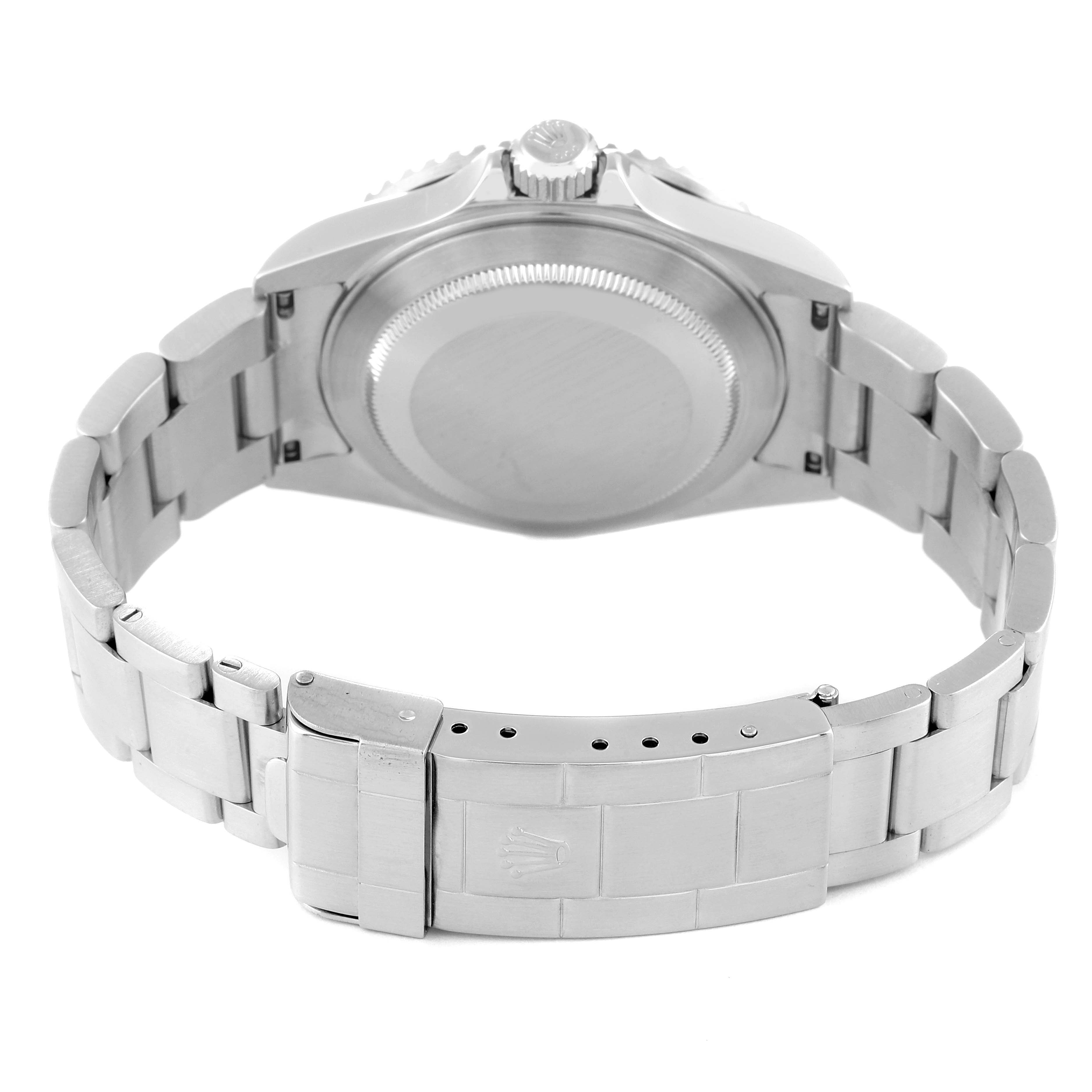 The image shows the back view of a Rolex Submariner 16610 Men
s Stainless Steel Black Dial 16610 Men
s Stainless Steel Black Dial watch, focusing on the case back and bracelet clasp.