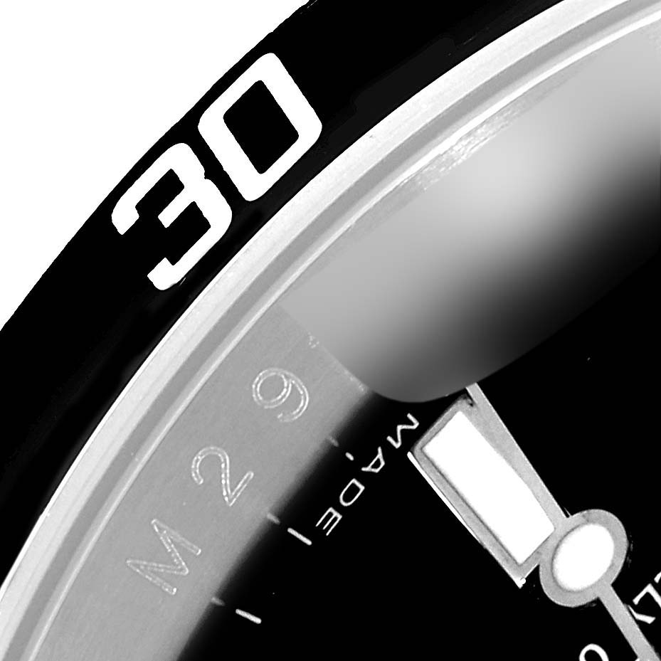 This close-up angle shows the bezel and part of the dial of the Rolex Submariner 16610 Men
s Stainless Steel Black Dial 16610 Men
s Stainless Steel Black Dial with the number "30" prominently displayed.