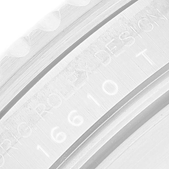 This close-up image shows the engraved inner bezel of a Rolex Submariner 16610 Men
s Stainless Steel Black Dial 16610 Men
s Stainless Steel Black Dial watch.