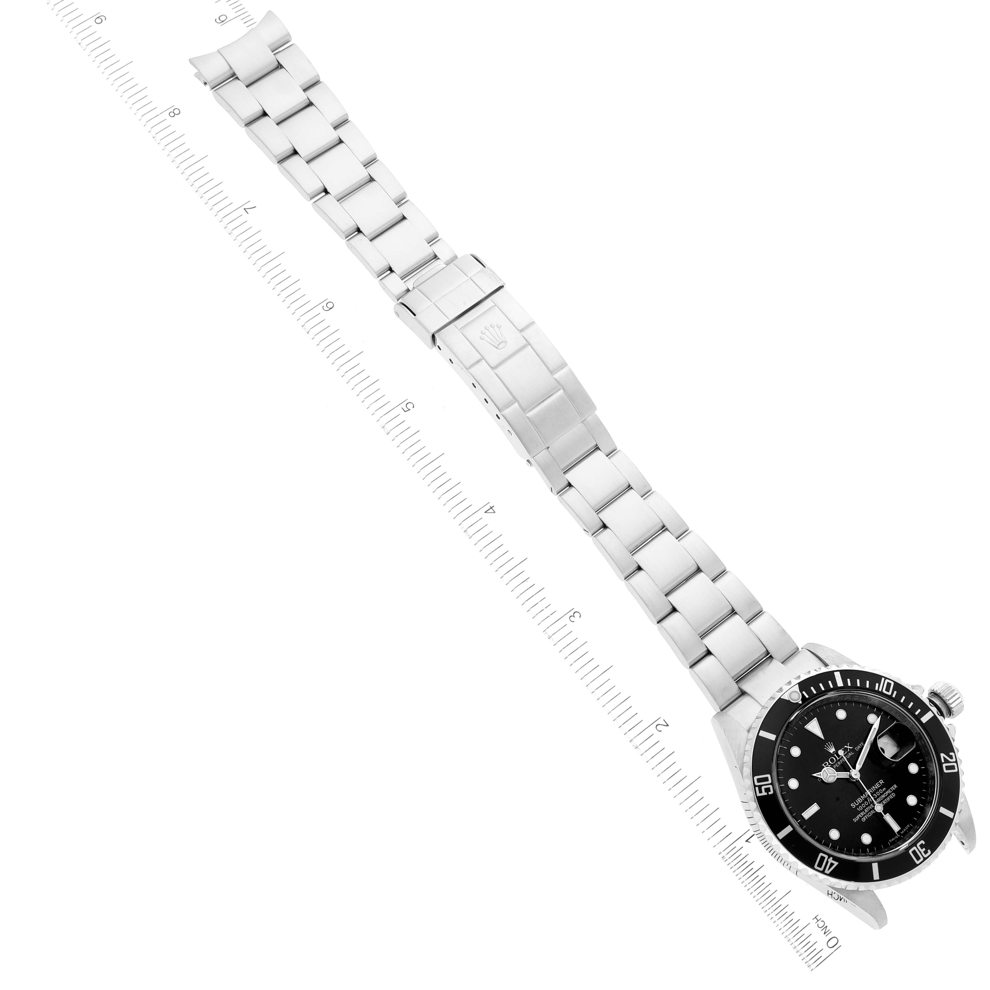 The image shows a Rolex Submariner 16610 Men
s Stainless Steel Black Dial 16610 Men
s Stainless Steel Black Dial watch laid flat with the face and metal bracelet fully visible.