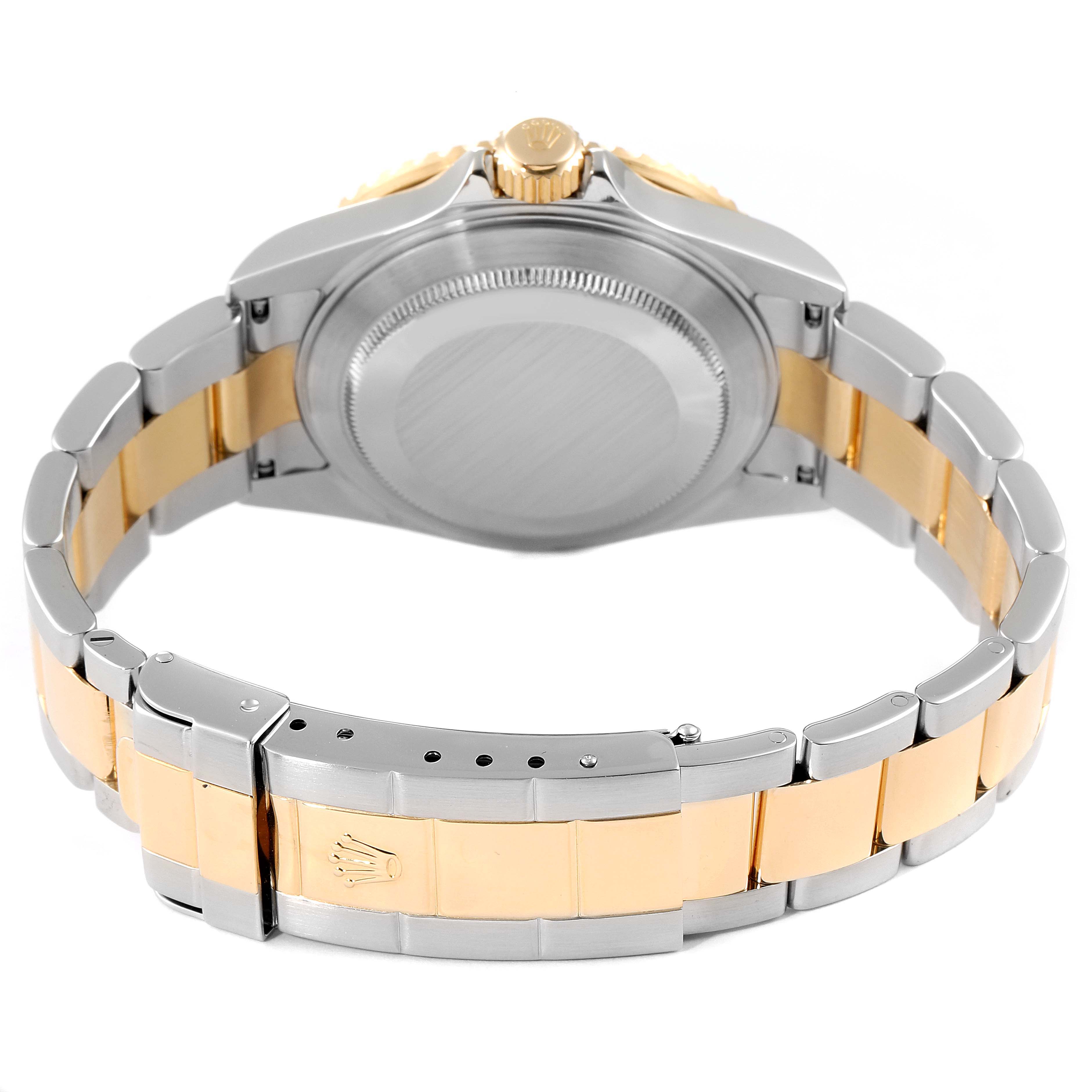 This image shows the back view of the Rolex Submariner 16613 Men's Steel and Gold (two tone) Blue Dial 16613 Men's Steel and Gold (two tone) Blue Dial watch, highlighting the clasp, bracelet, and case back.