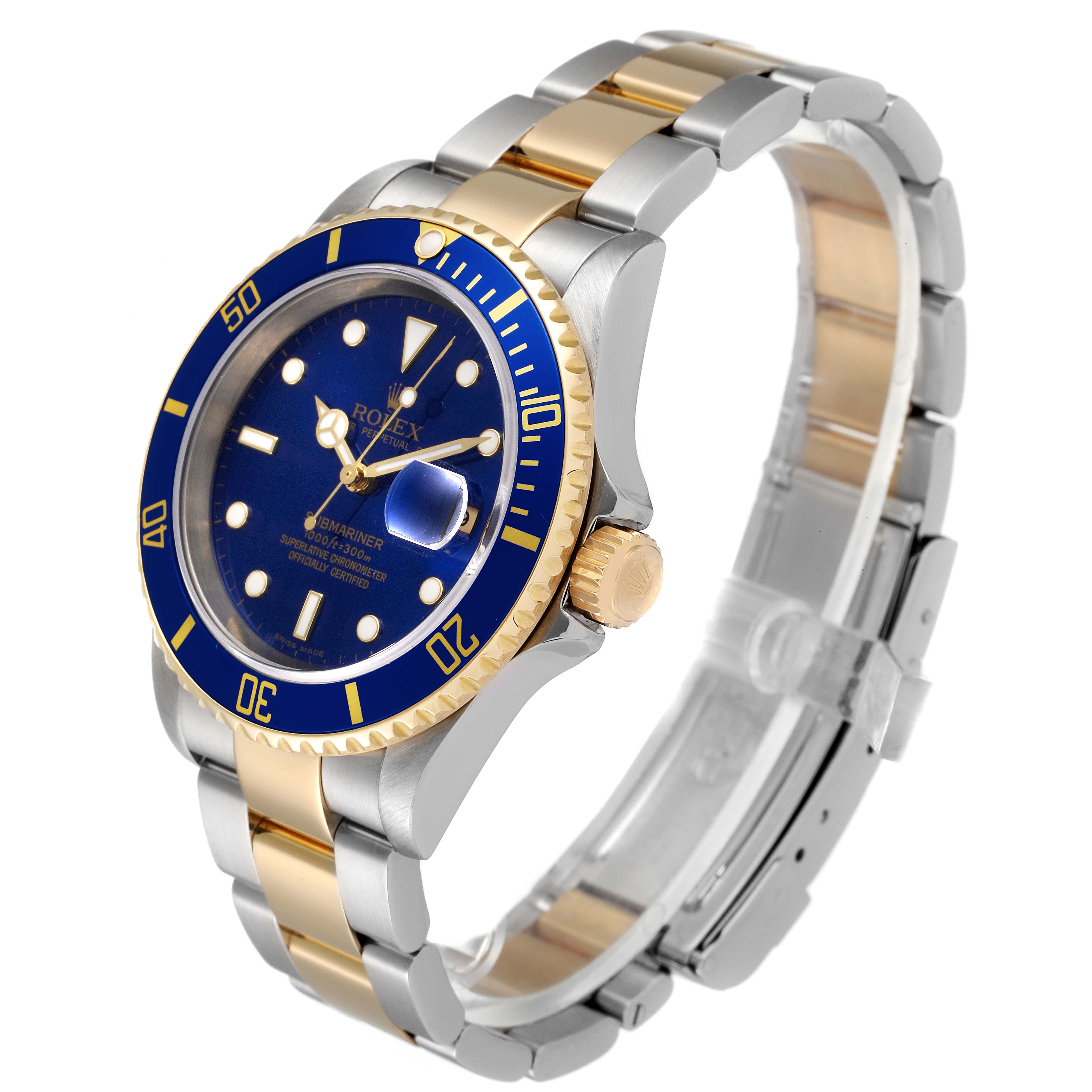 The image shows a Rolex Submariner 16613 Men's Steel and Gold (two tone) Blue Dial 16613 Men's Steel and Gold (two tone) Blue Dial watch at a three-quarter angle, highlighting its blue dial, gold bezel, and two-tone bracelet.