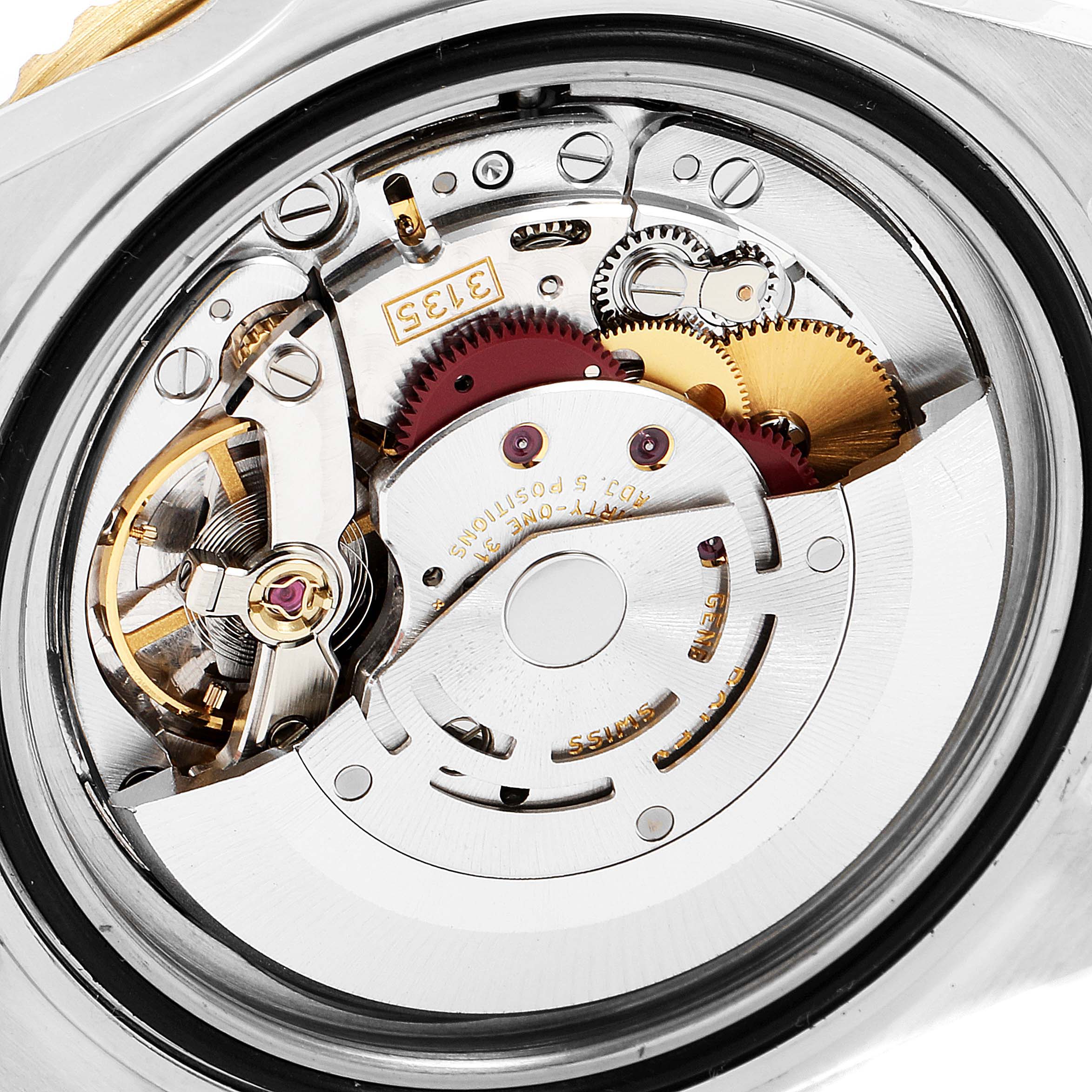 This image shows the movement mechanism of a Rolex Submariner 16613 Men's Steel and Gold (two tone) Blue Dial 16613 Men's Steel and Gold (two tone) Blue Dial watch from a back angle.